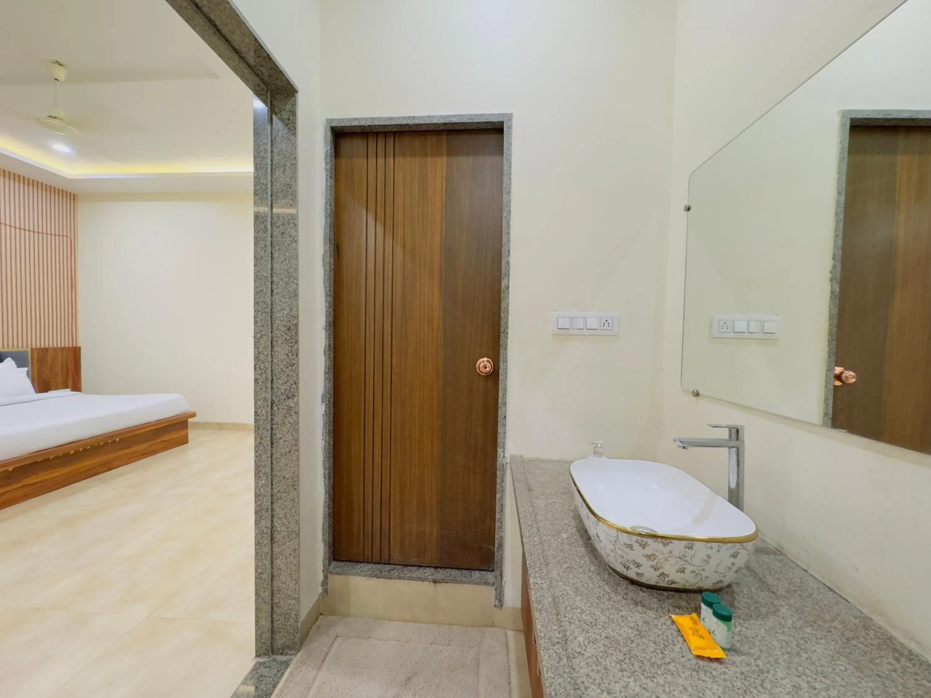 Shower in Hotel Jyotirlinga- One Way Drop to Mahakal Temple