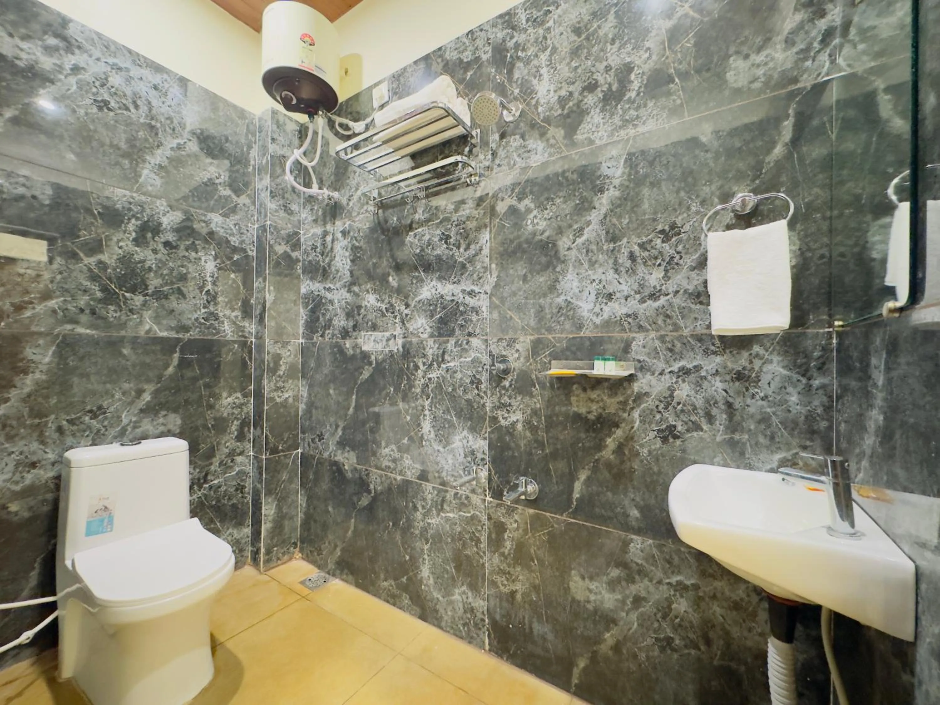 Shower in Hotel Jyotirlinga- One Way Drop to Mahakal Temple