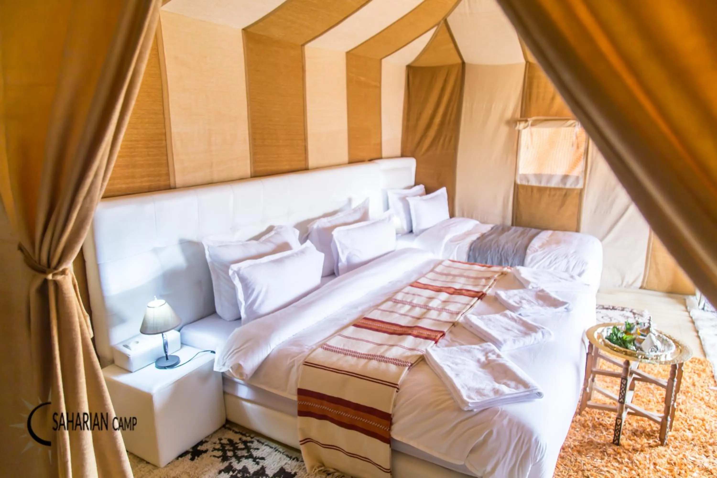 Bed in Merzouga Luxury Camp