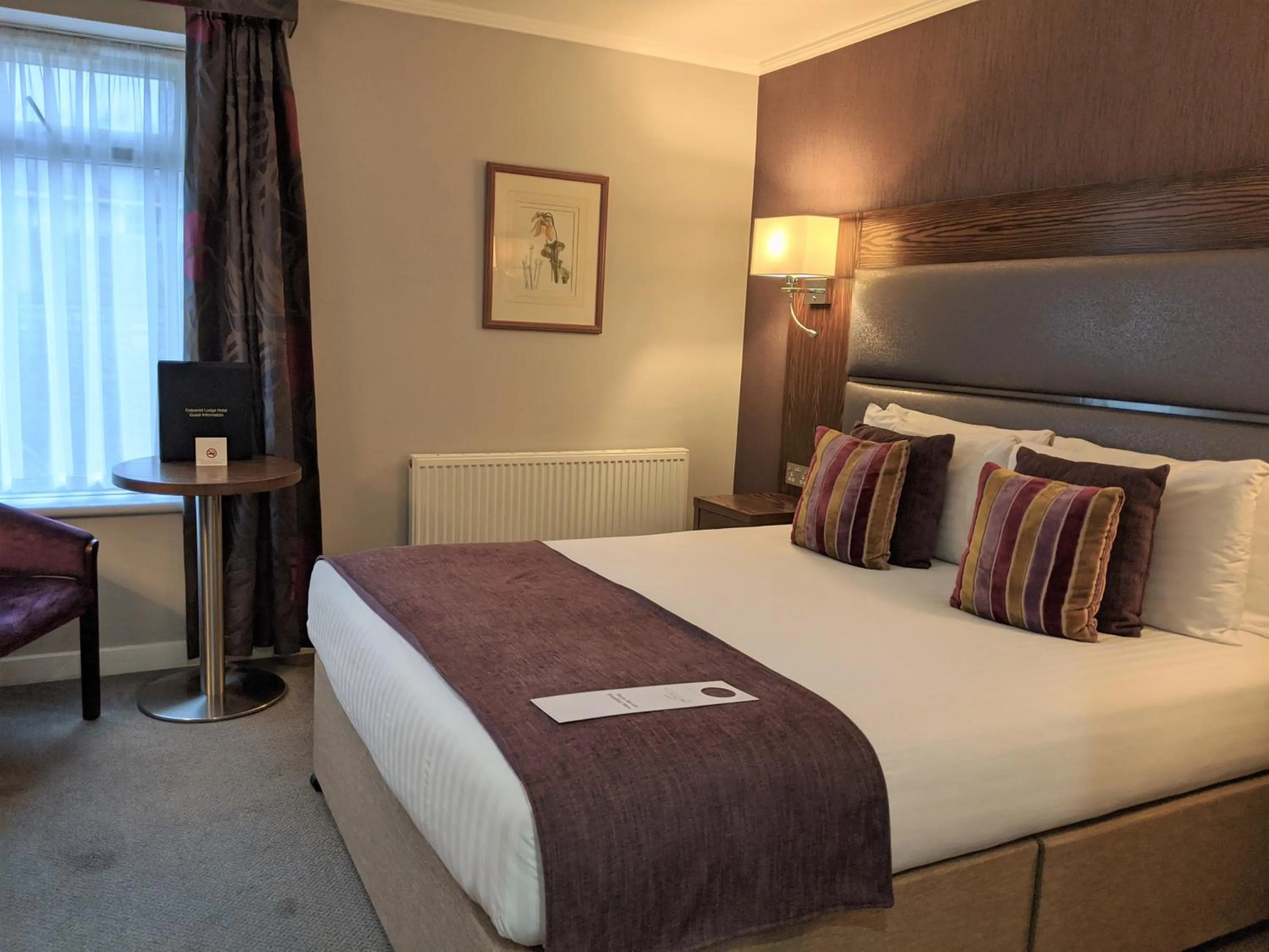 Bed in Cotswold Lodge Hotel