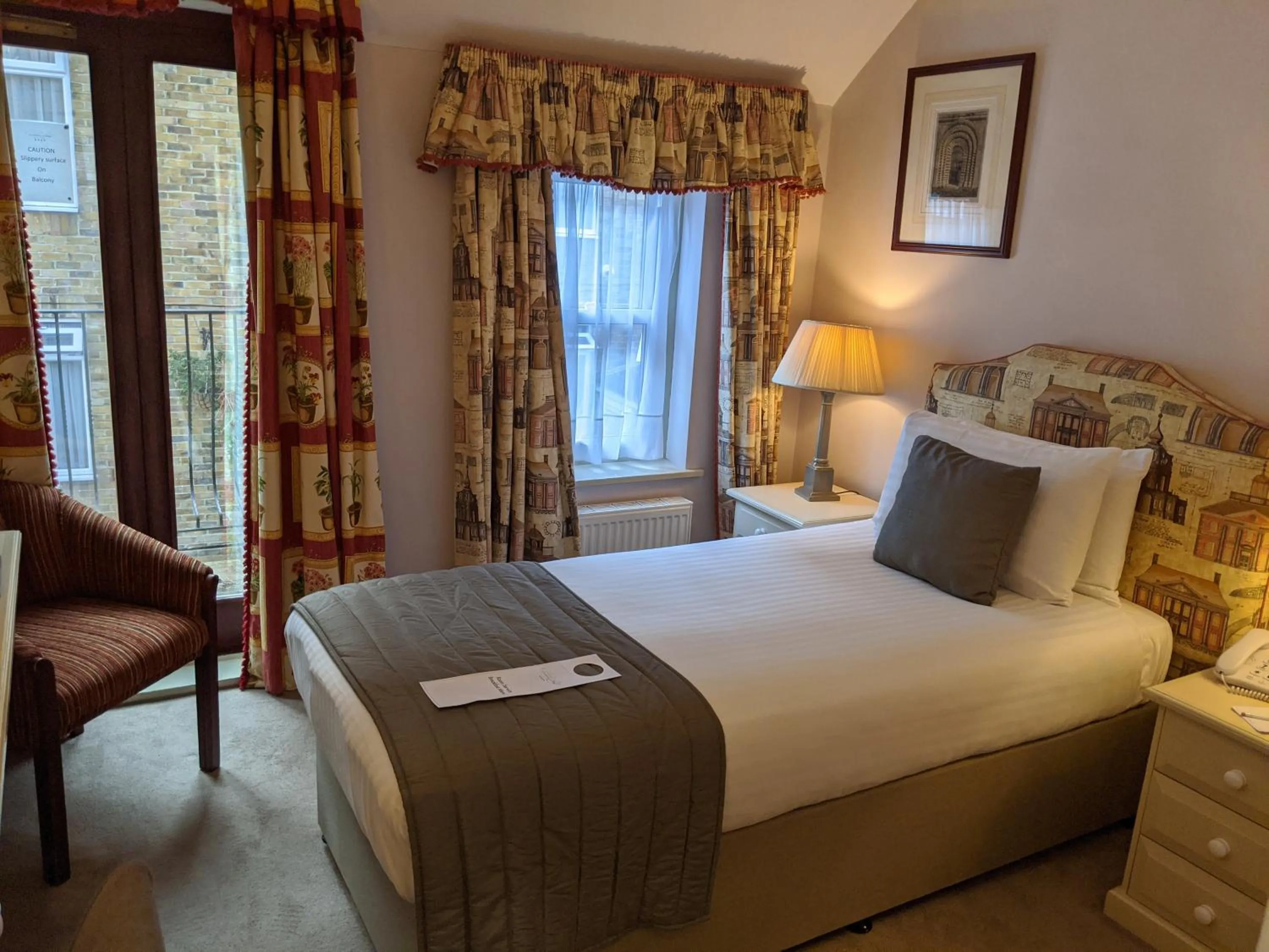 Bed in Cotswold Lodge Hotel