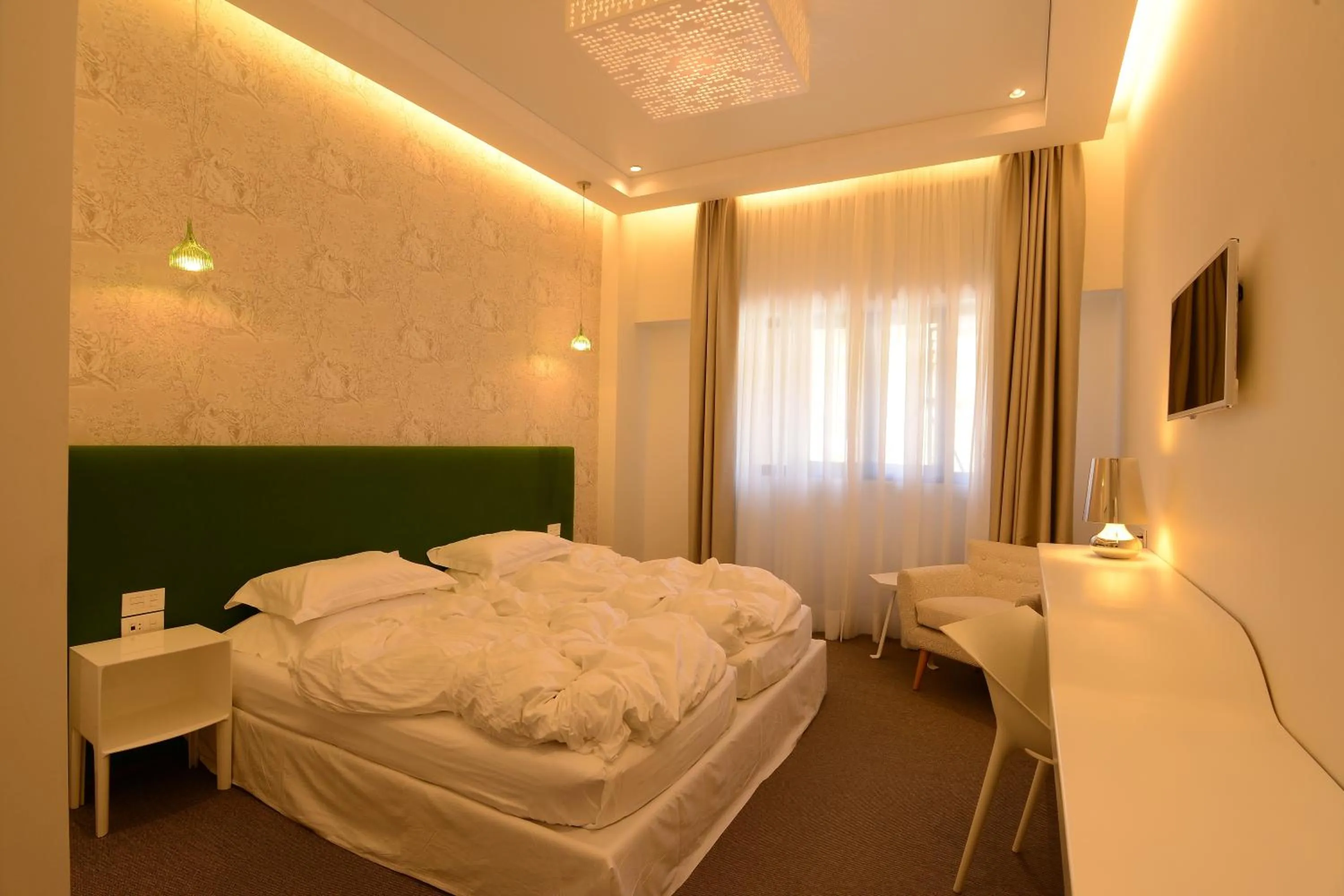 Bed in Miramar Hotel Resort and Spa