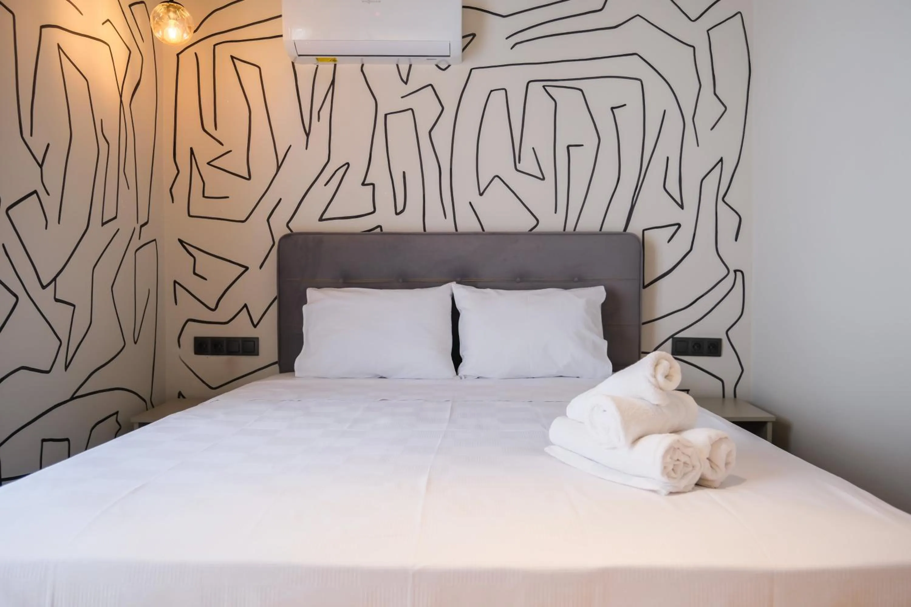 Bed in RudBlu Suites