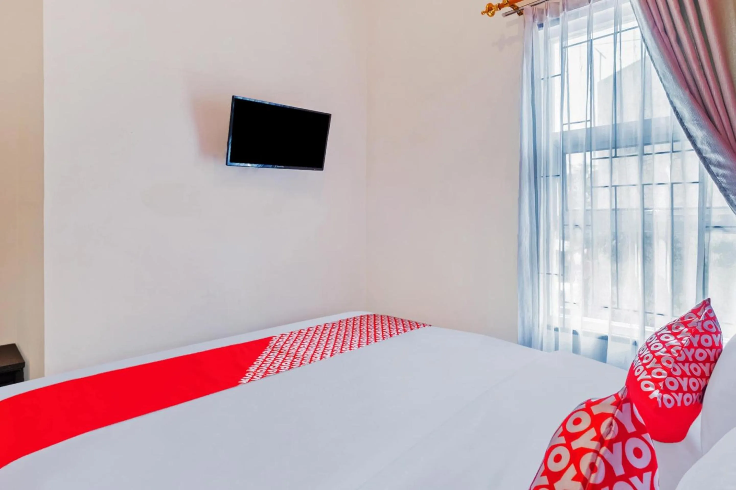 Bedroom in Hotel O Sudirman Guesthouse Syariah