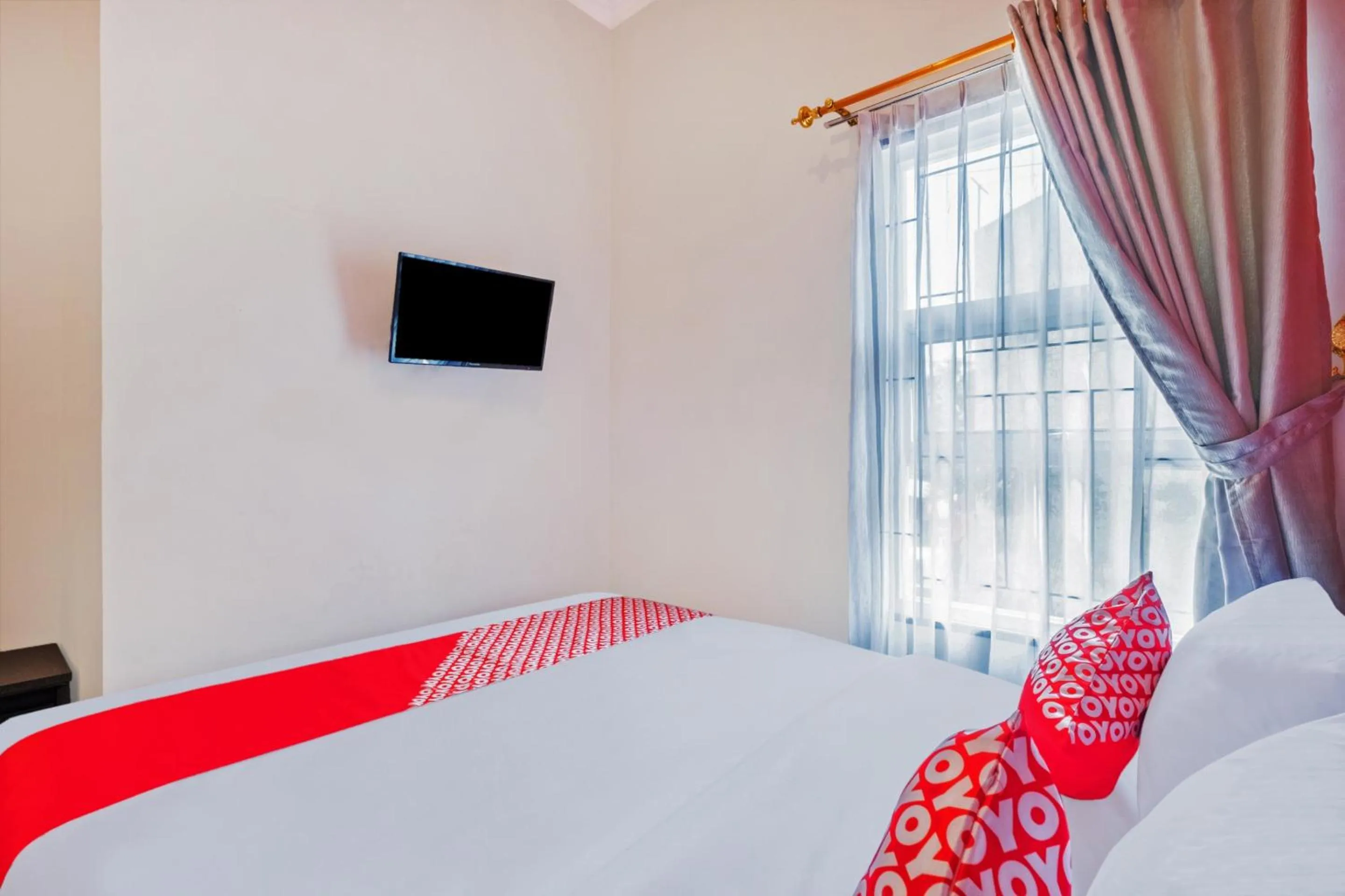 Bedroom in Hotel O Sudirman Guesthouse Syariah