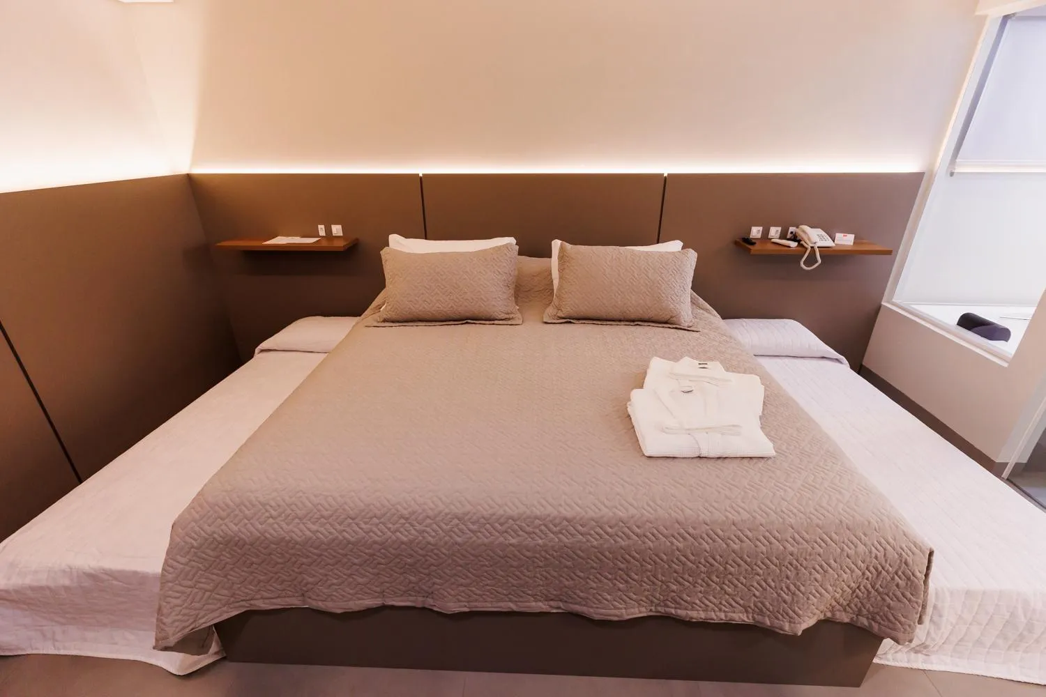 Bed in Tonello Business Hotel