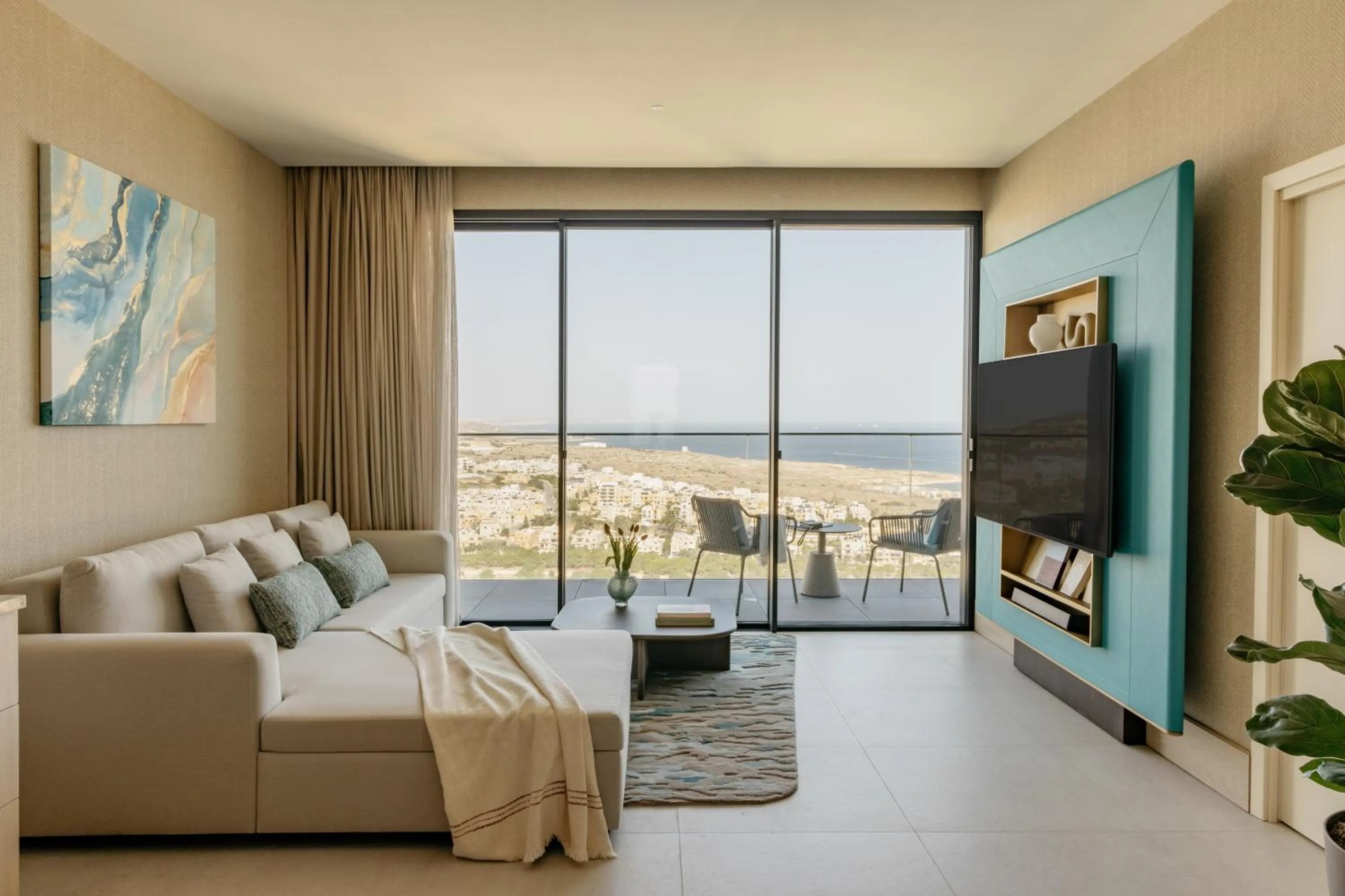 Communal lounge/ TV room in ME Malta by Meliá