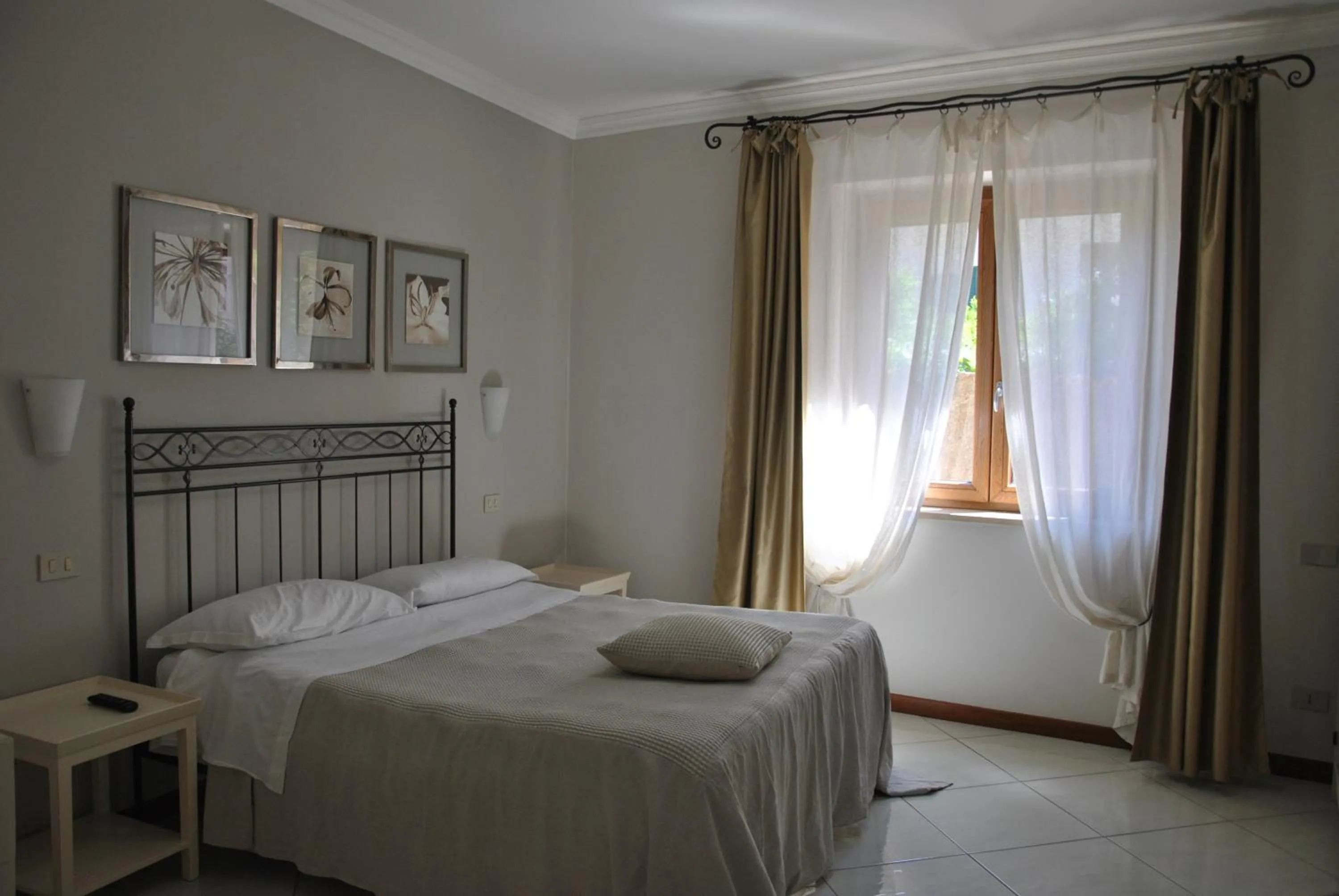 Photo of the whole room, Bed in Il Bottone D'Argento