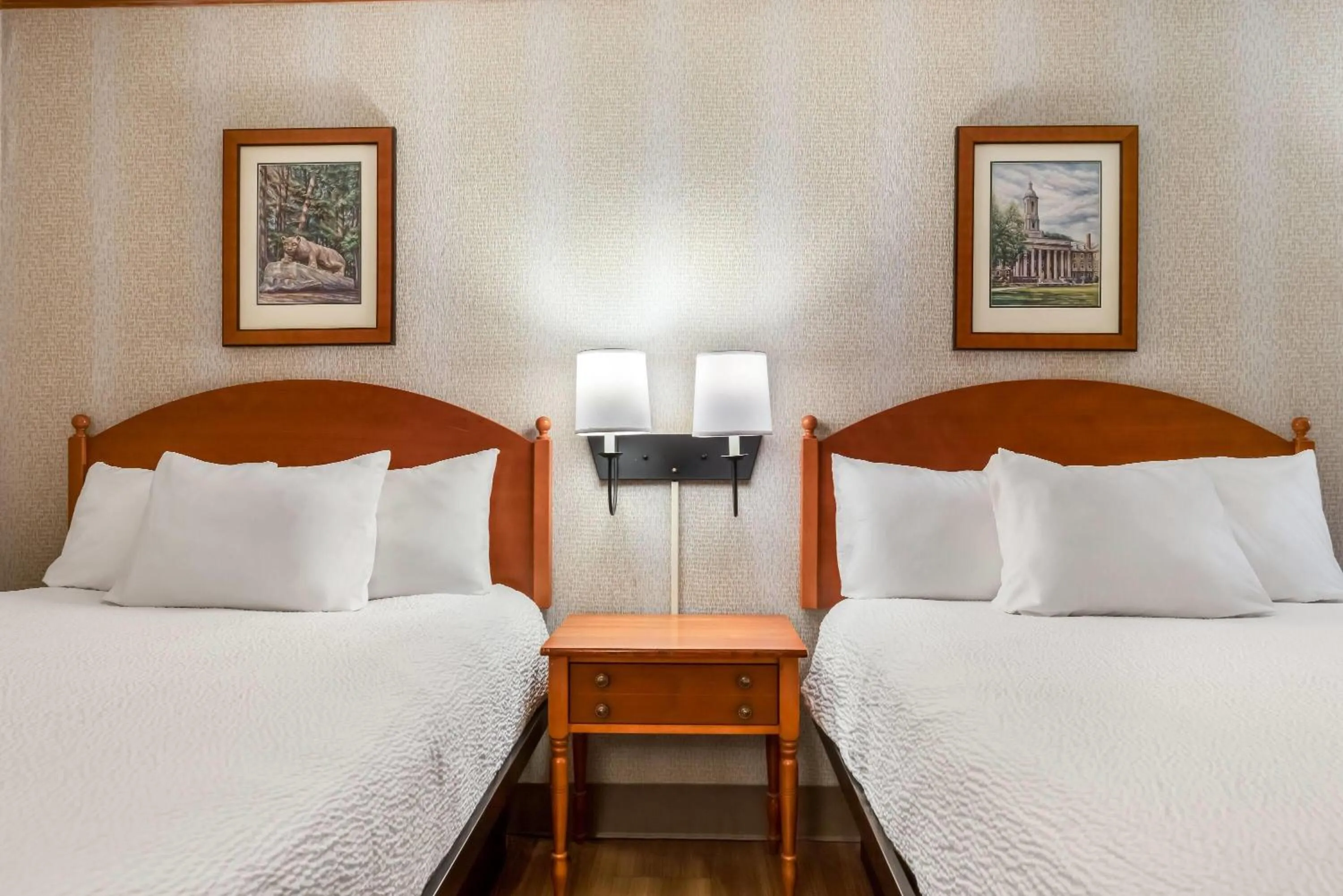 Bed in Ramada by Wyndham State College Hotel & Conference Center