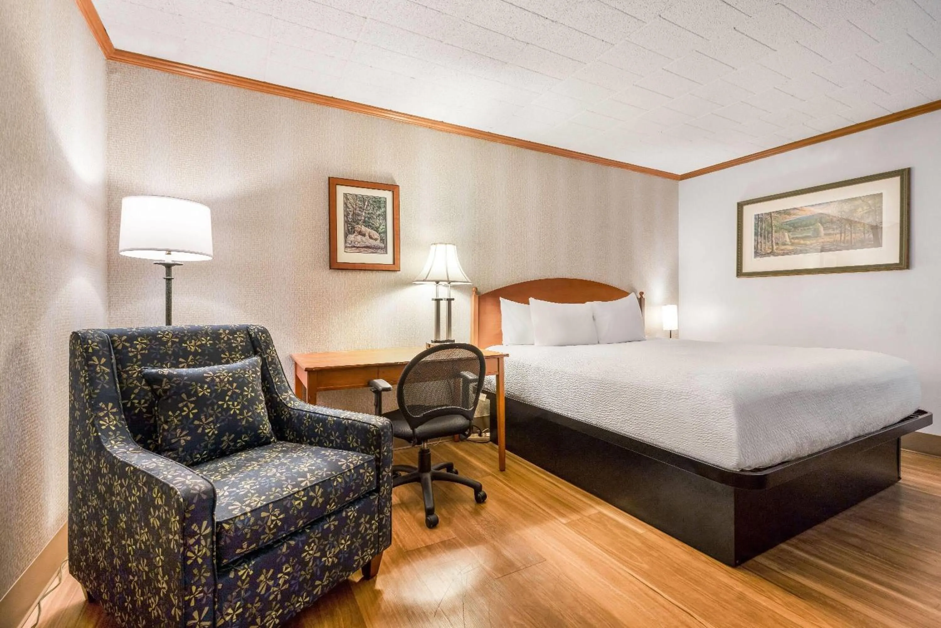 Bed in Ramada by Wyndham State College Hotel & Conference Center