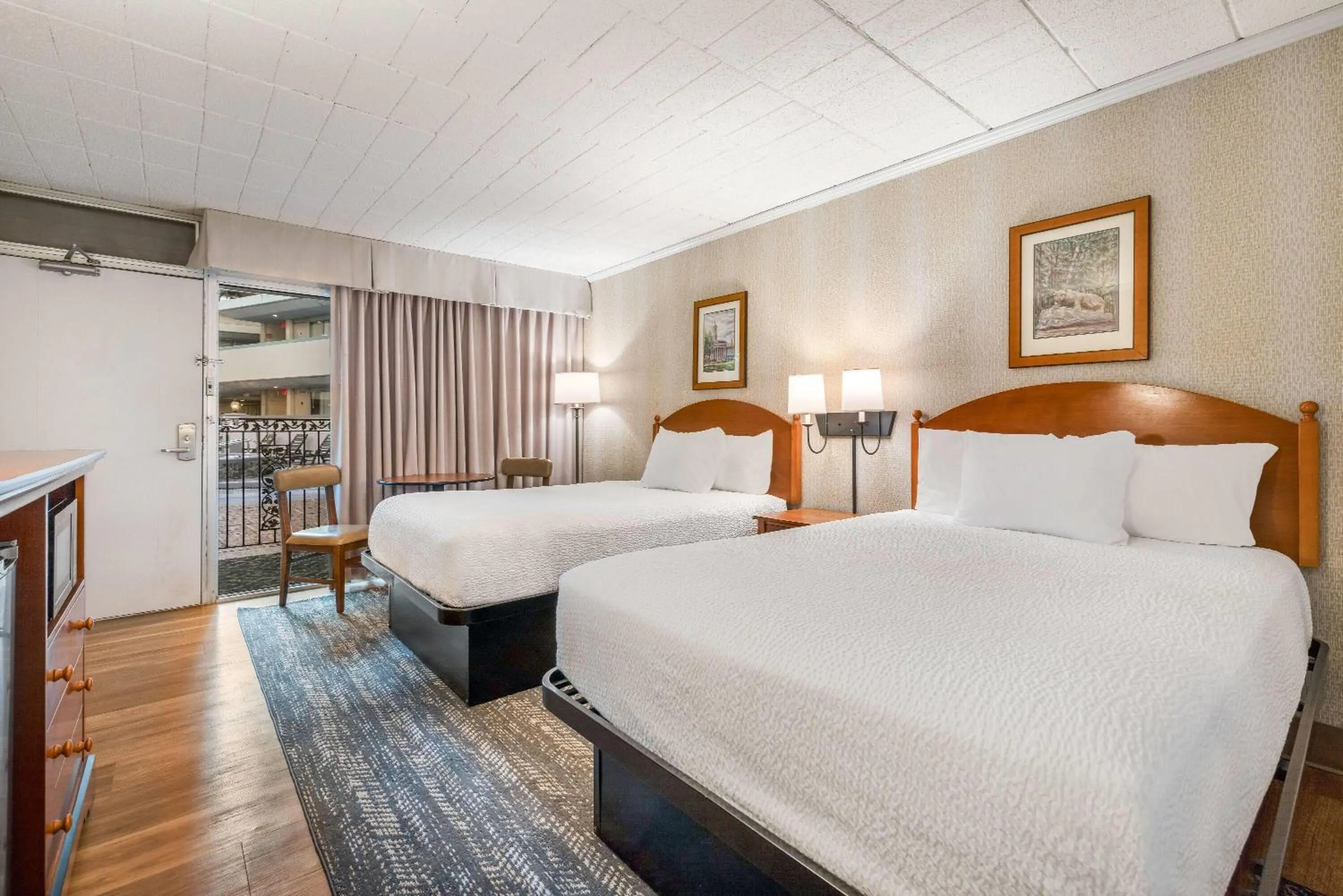 Bed in Ramada by Wyndham State College Hotel & Conference Center