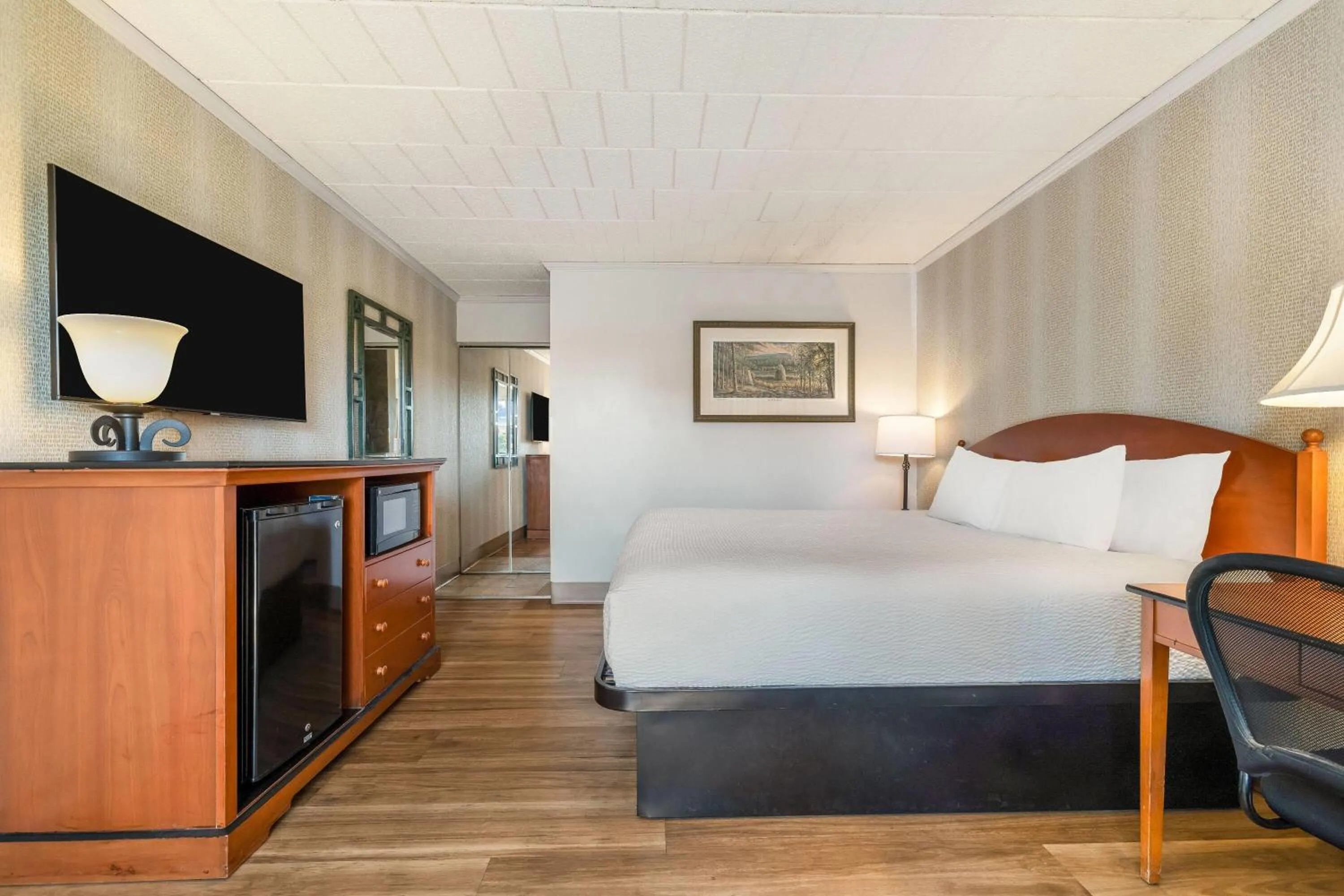 Bed in Ramada by Wyndham State College Hotel & Conference Center