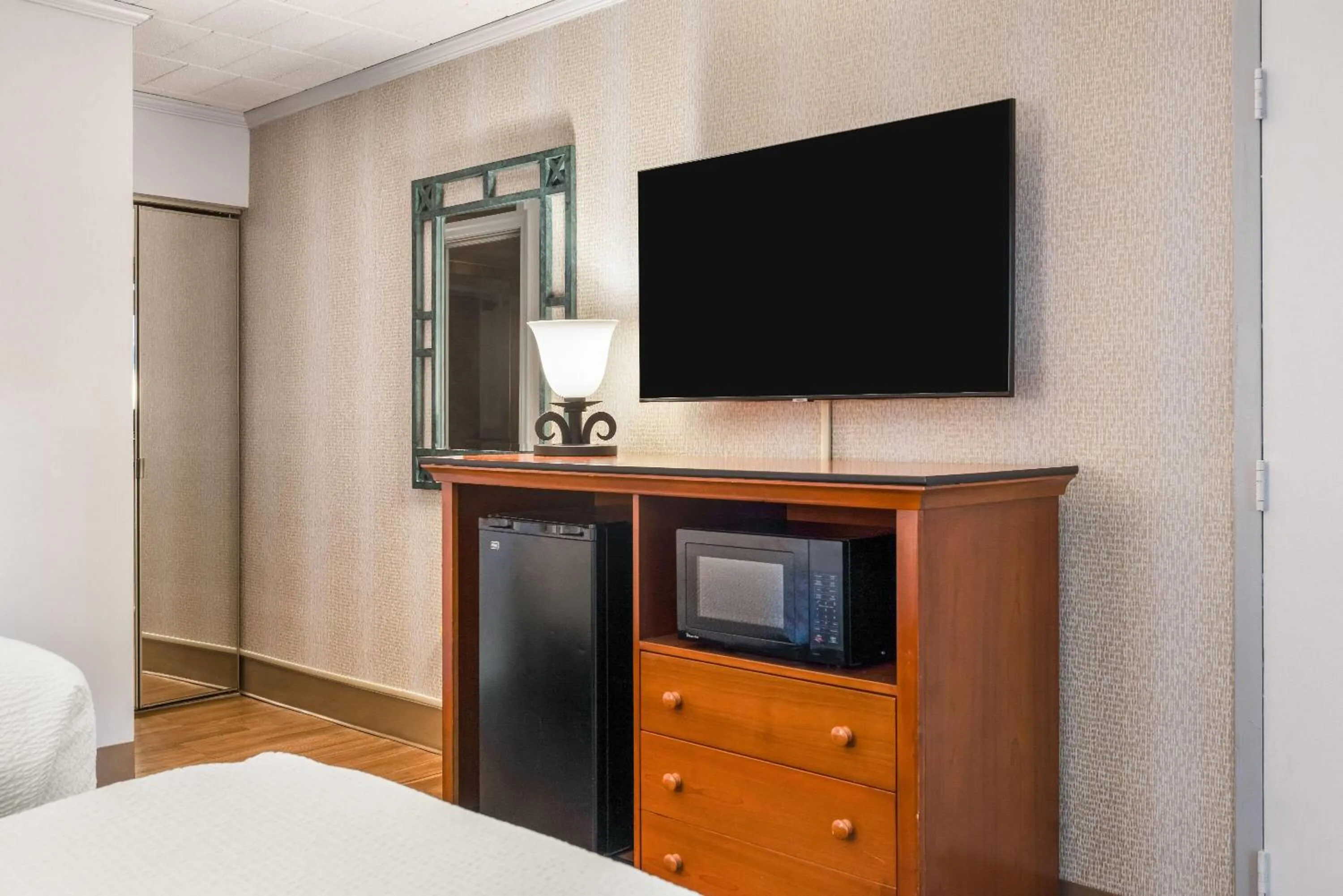 Bed in Ramada by Wyndham State College Hotel & Conference Center