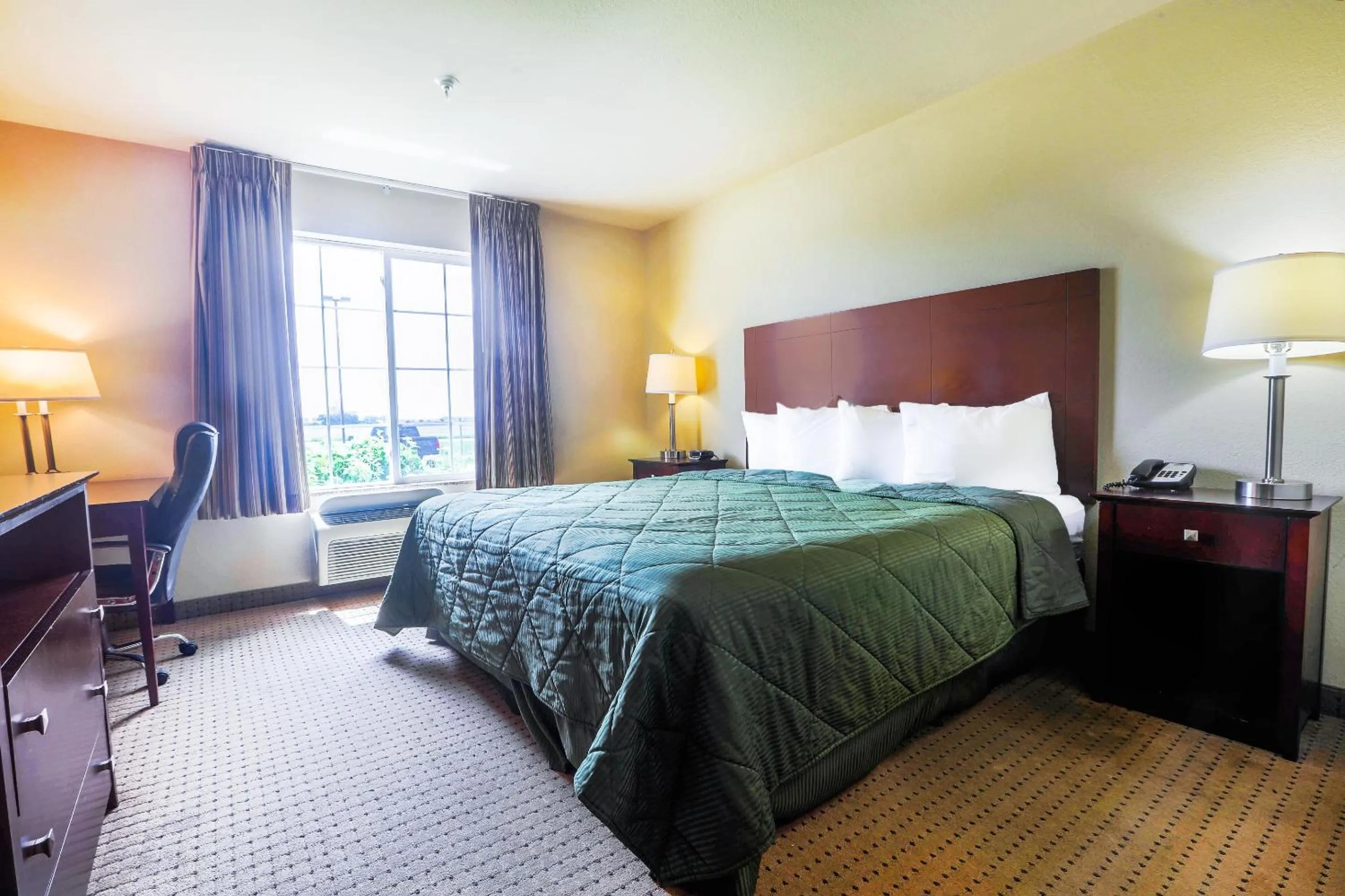 Bedroom in Evansville Inn & Suites by OYO