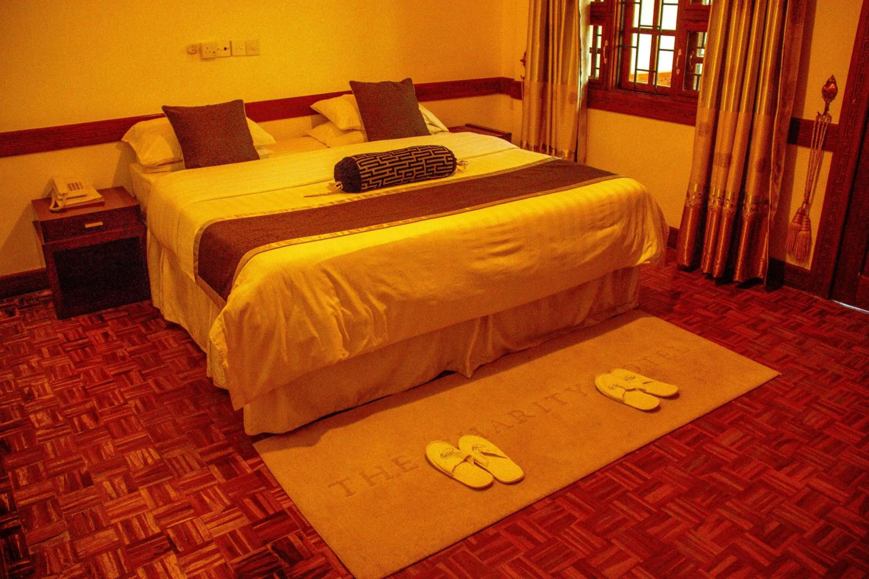 Bed in The Charity Hotel International