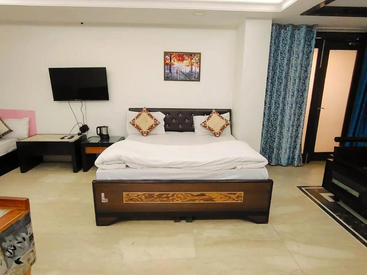 Bed in Taj Inn Residency