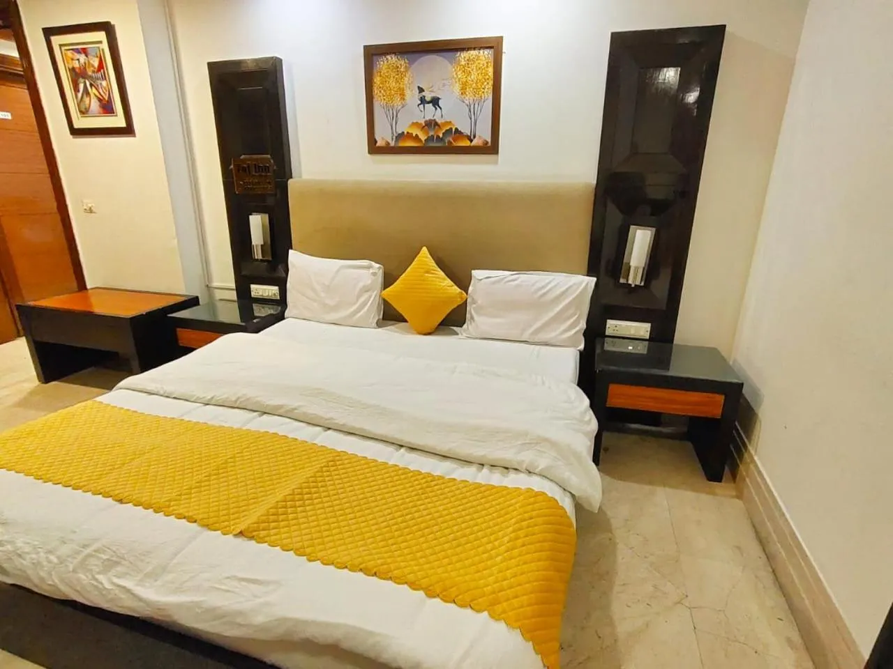 Bed in Taj Inn Residency