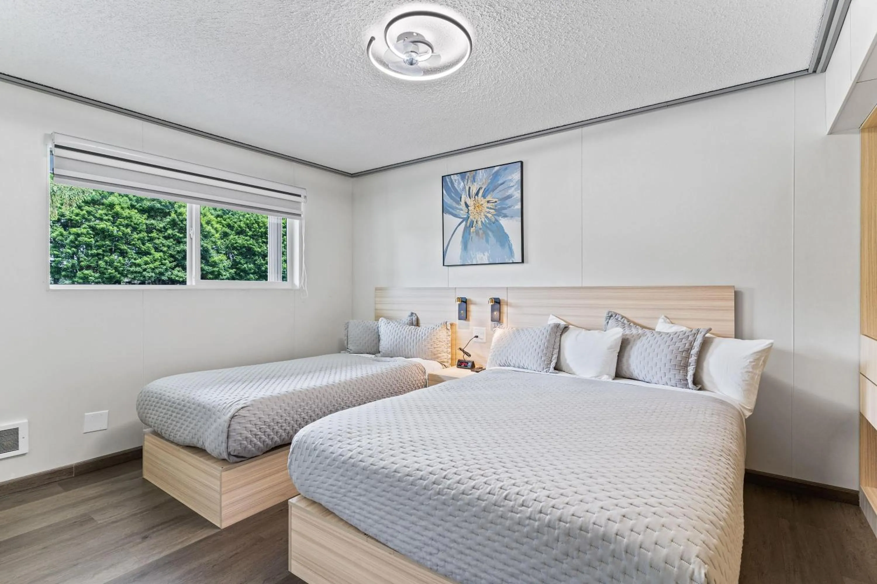 One-Bedroom Queen Suite with One Twin Bed and River View - Non-Smoking in Interurban Suites Hotel, a Dazzler Select by Wyndham