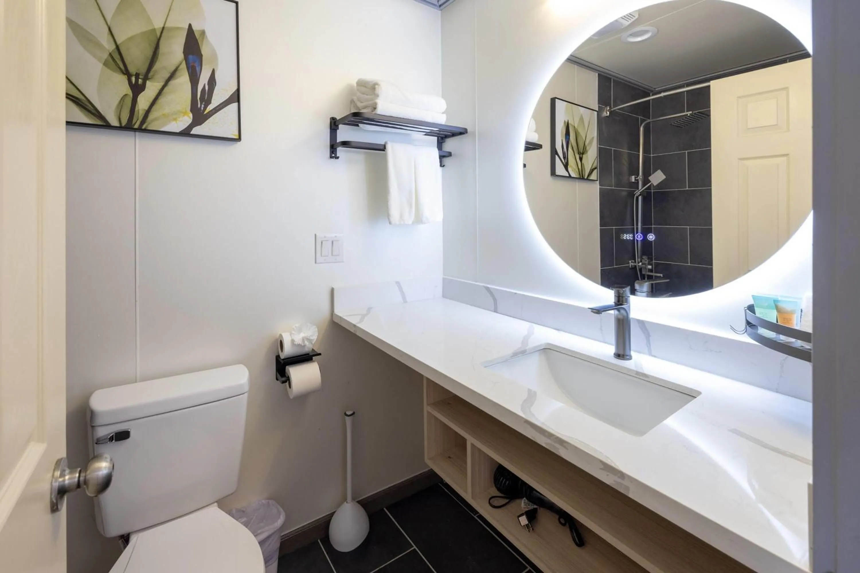 Bathroom in Interurban Suites Hotel, a Dazzler Select by Wyndham