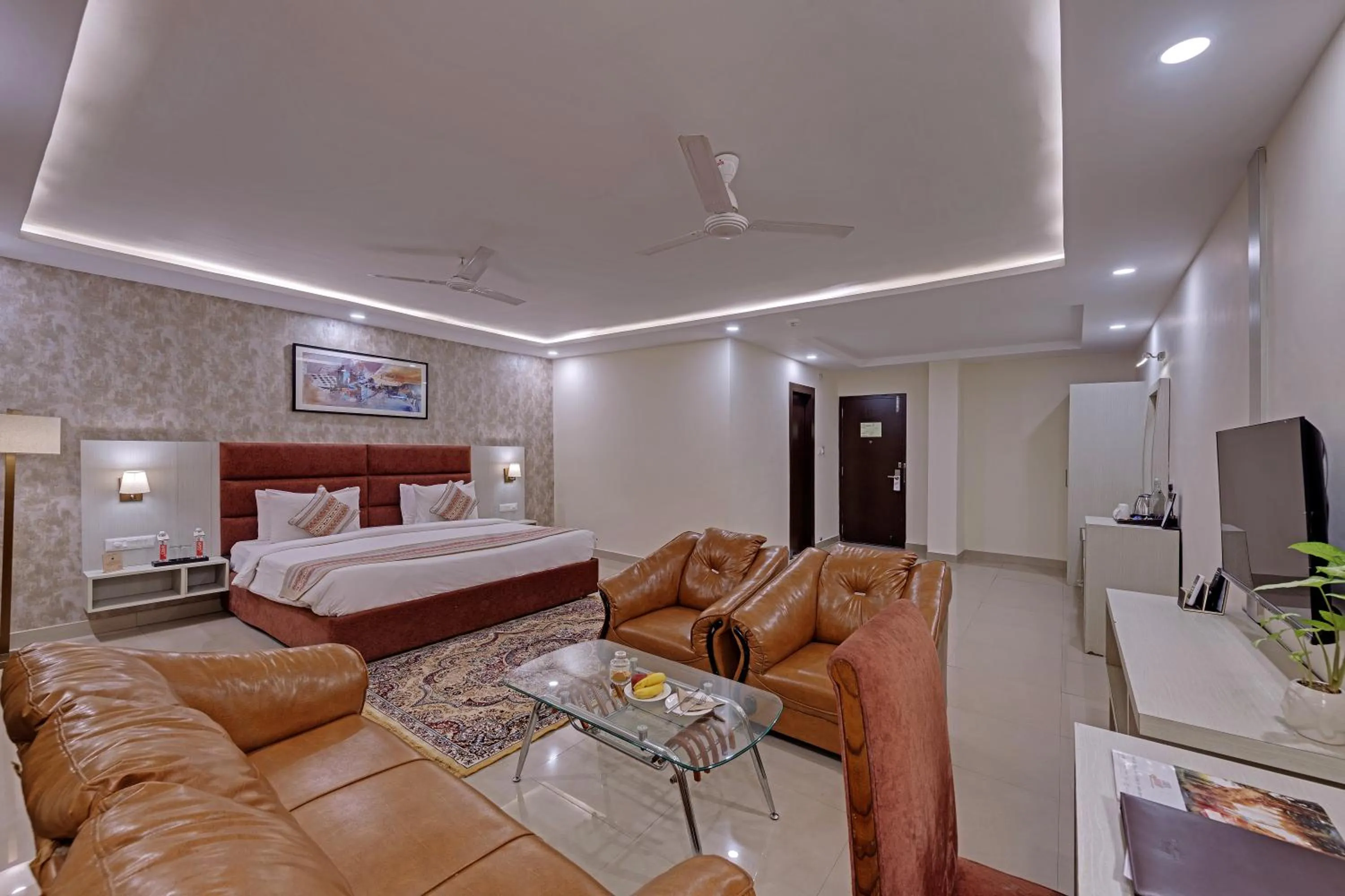 Seating area, Bed in The Fern Residency, Bodhgaya, Series by Marriott