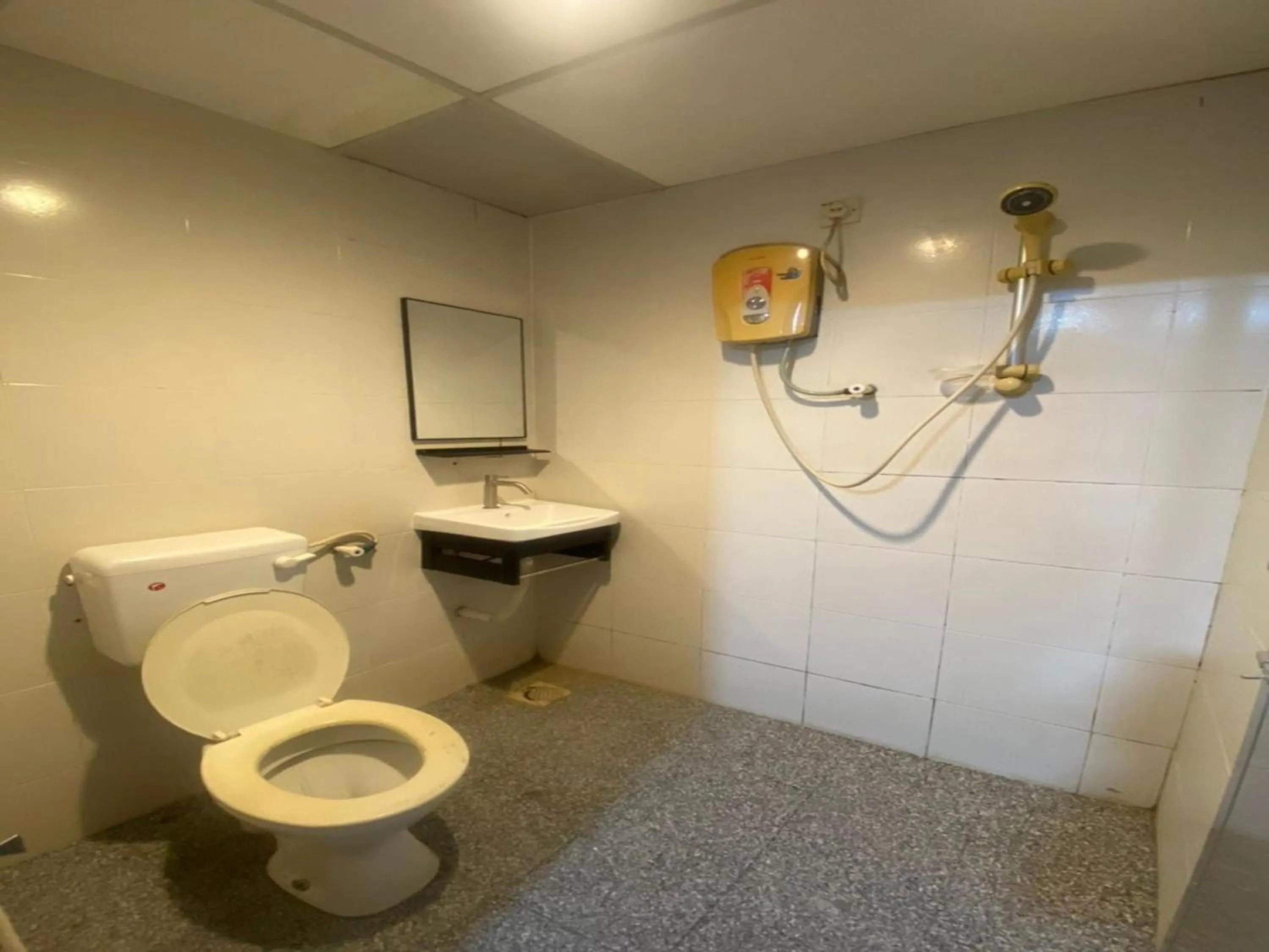 Bathroom in Hotel O Captain Hotel Cafe & Bistro