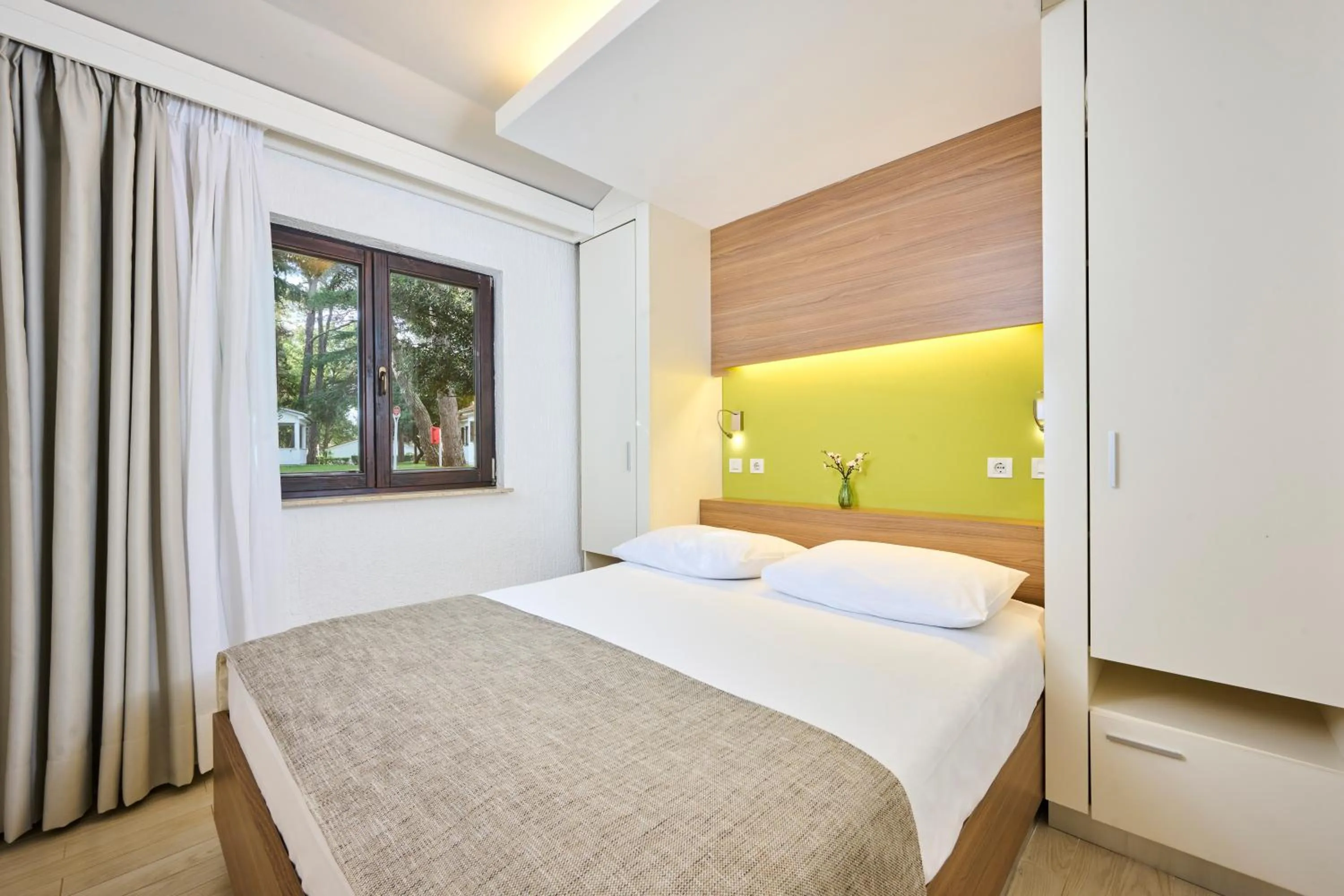 Bed in Apartments Galijot Plava Laguna