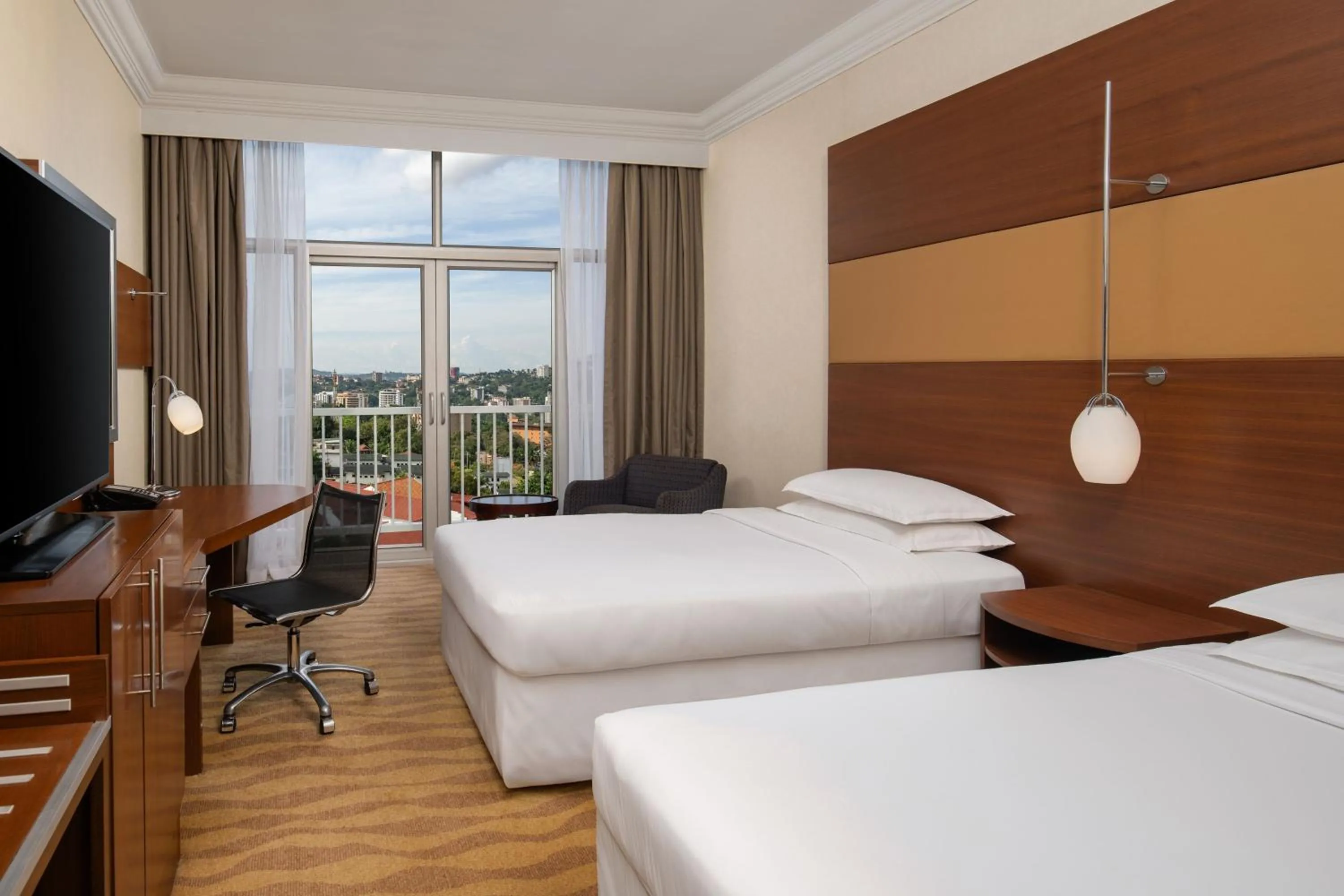 Photo of the whole room, Bed in Sheraton Kampala Hotel