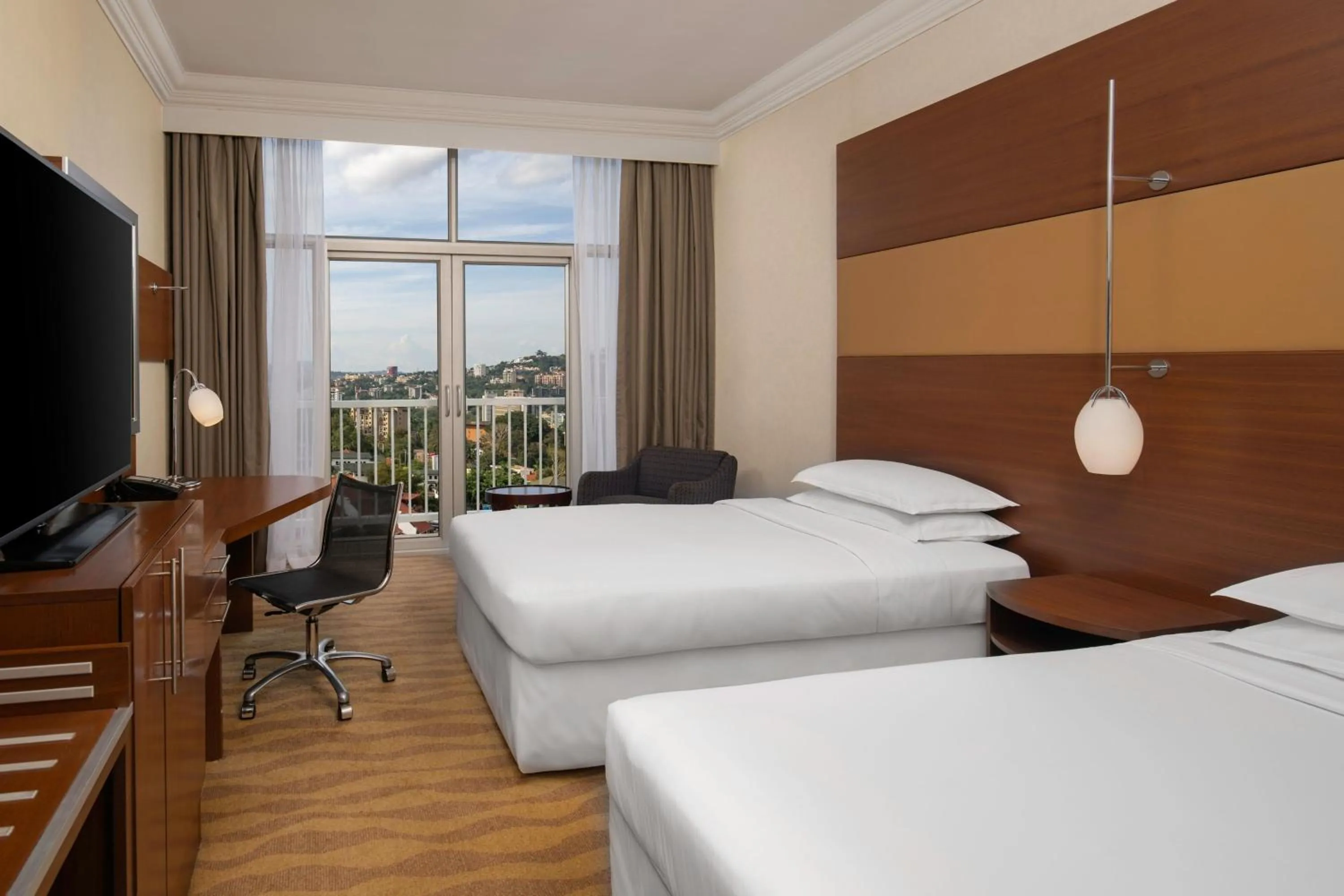 Photo of the whole room, Bed in Sheraton Kampala Hotel