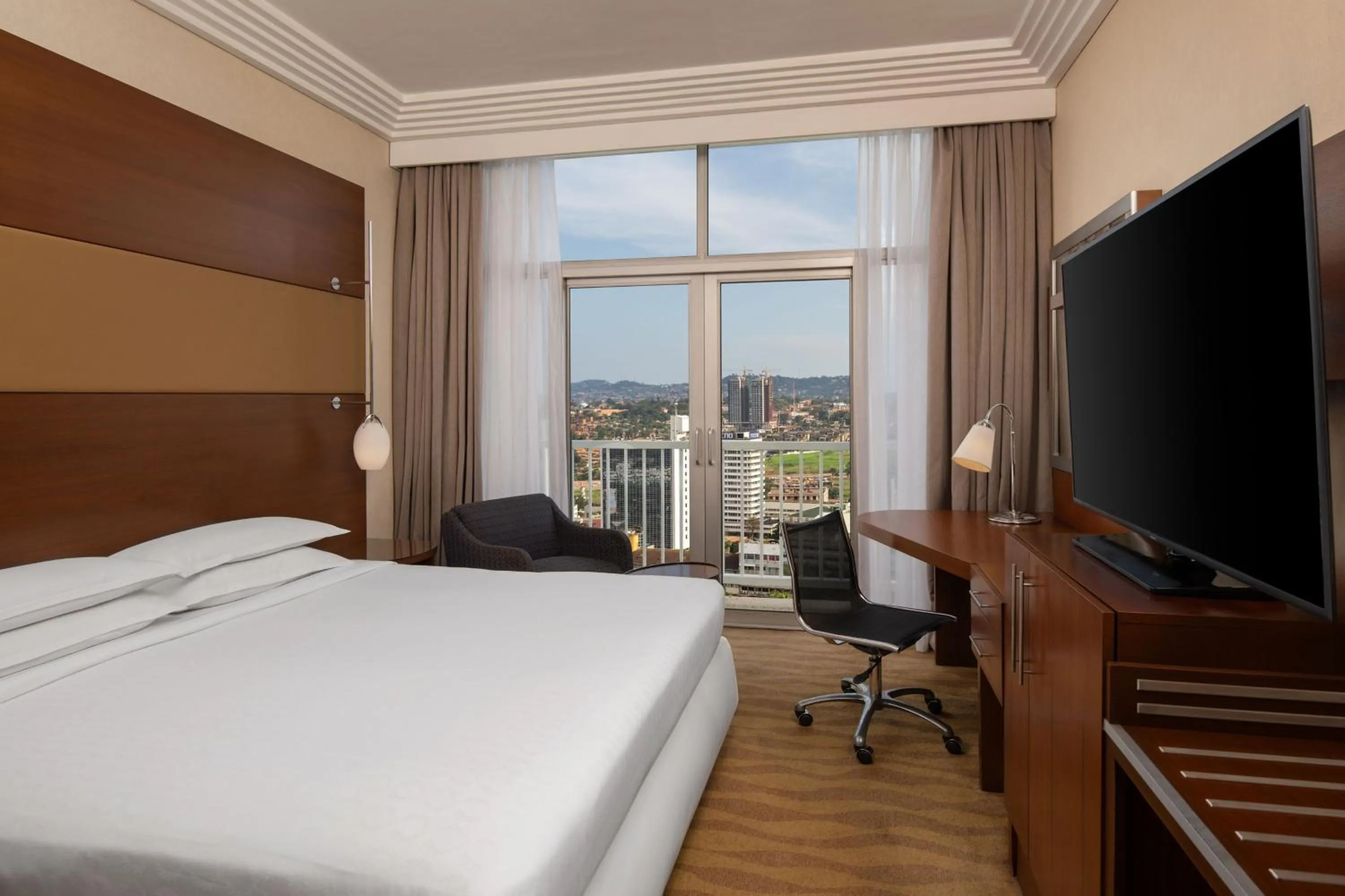 Photo of the whole room, Bed in Sheraton Kampala Hotel