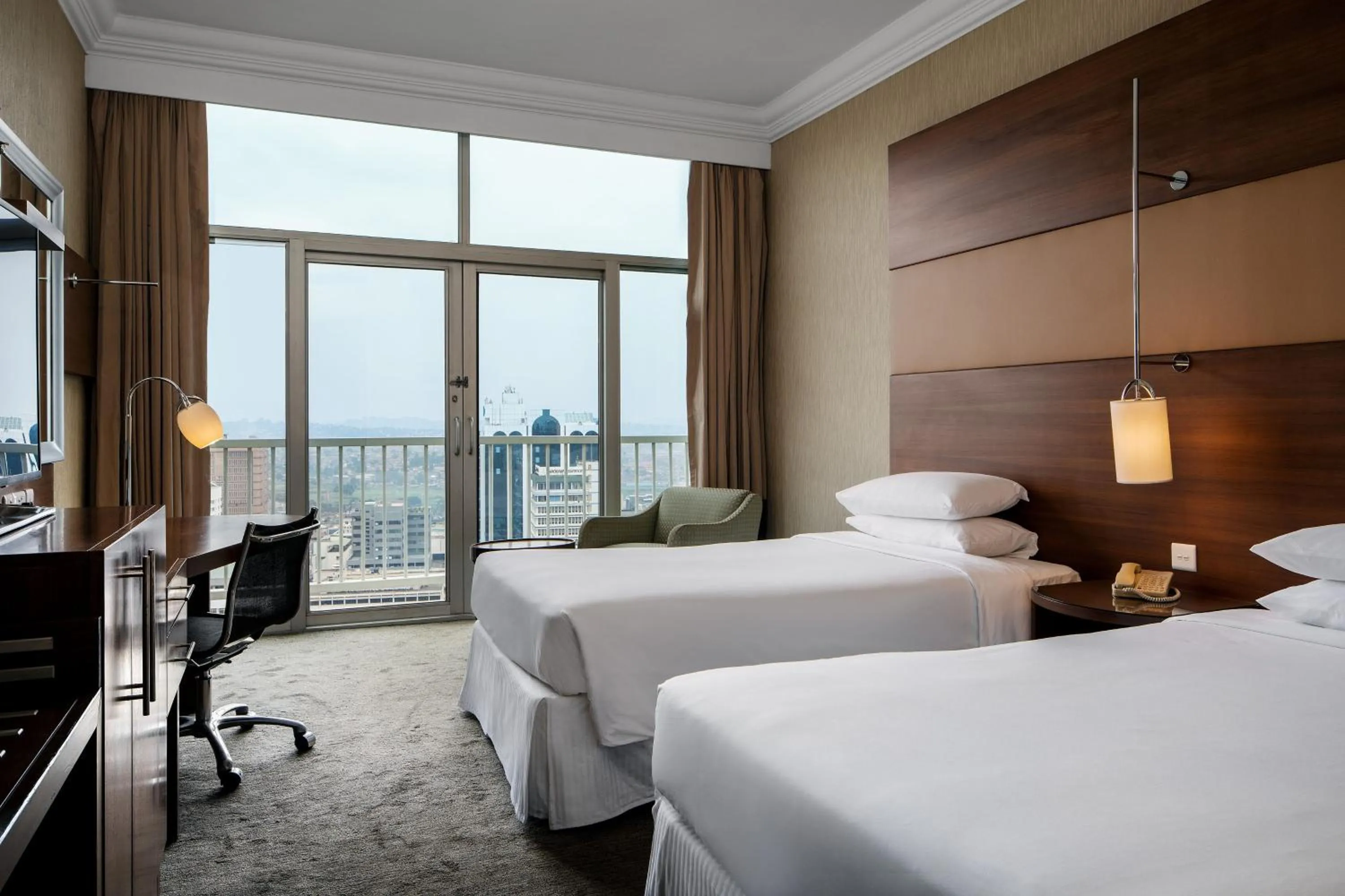 Photo of the whole room, Bed in Sheraton Kampala Hotel