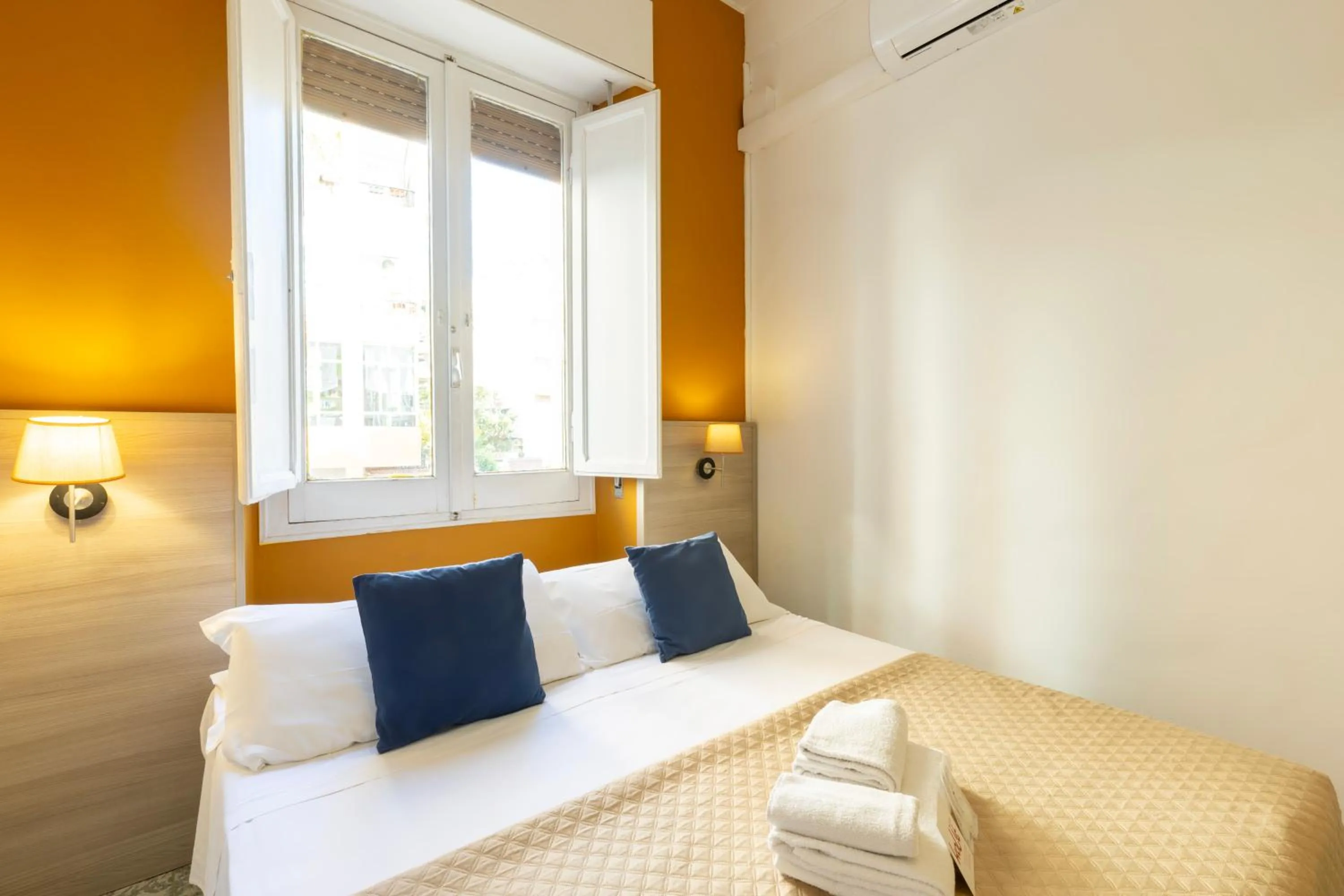 Bed in Kaliè Rooms Guest House