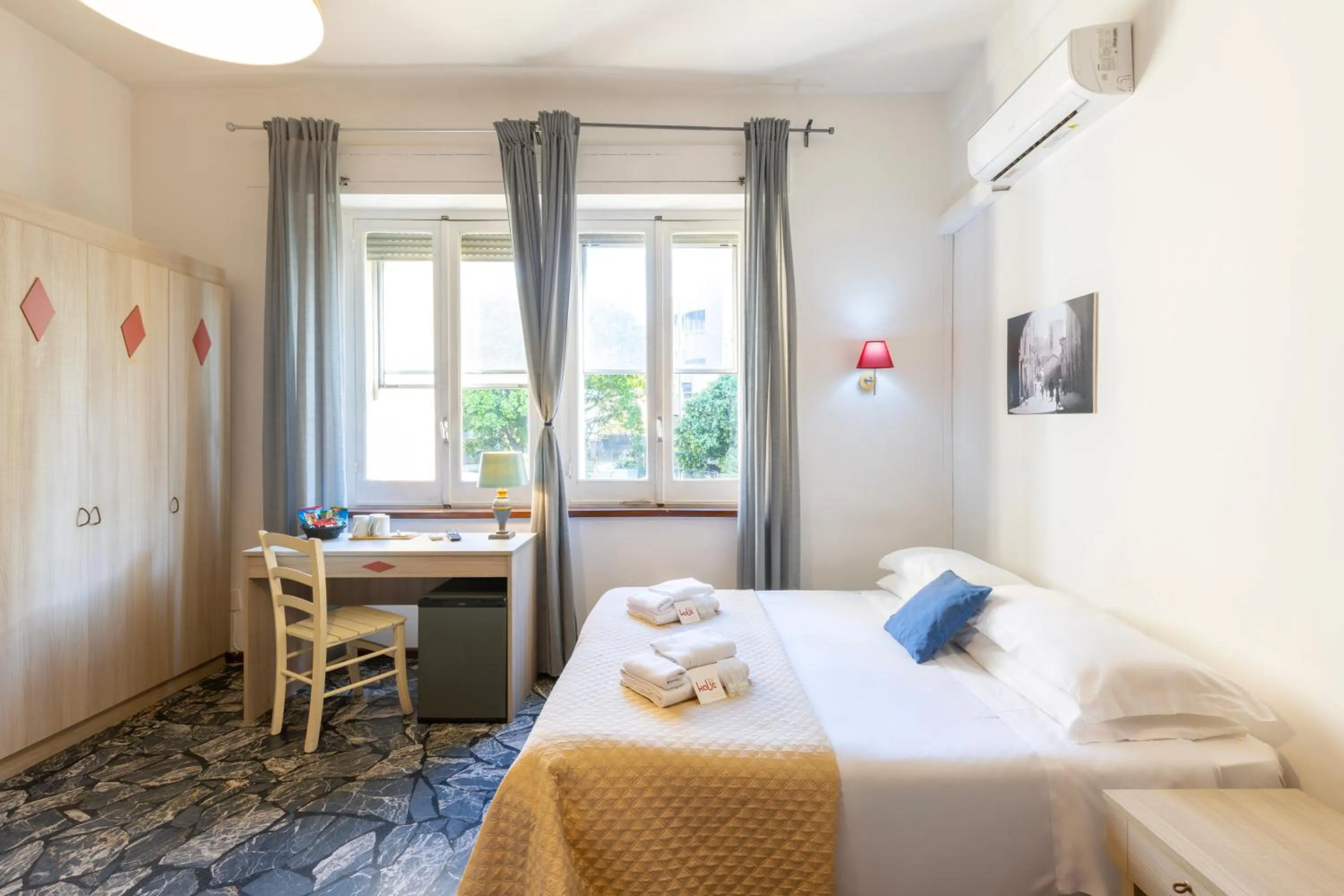 Bed in Kaliè Rooms Guest House