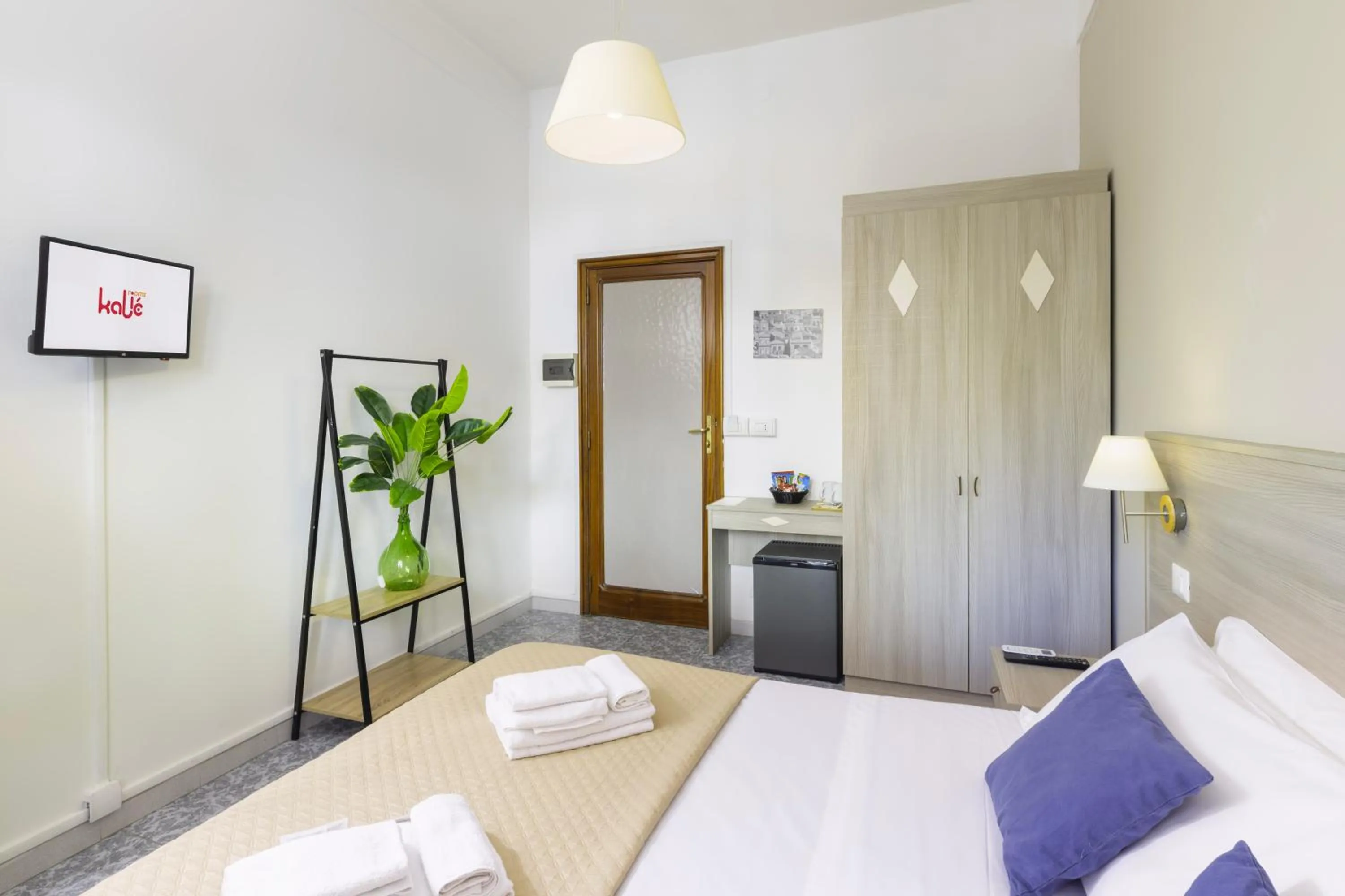 Bed in Kaliè Rooms Guest House