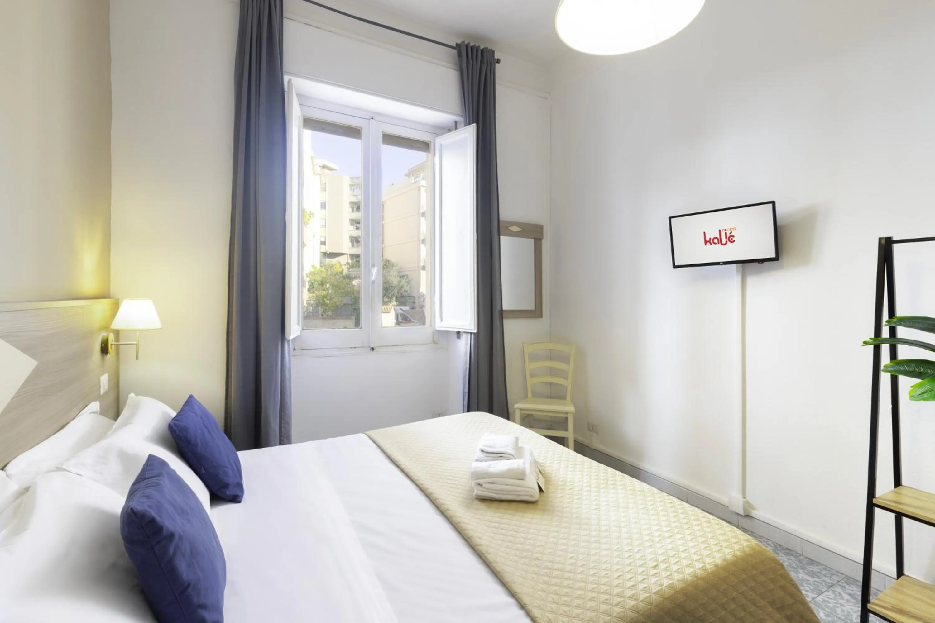 Bed in Kaliè Rooms Guest House