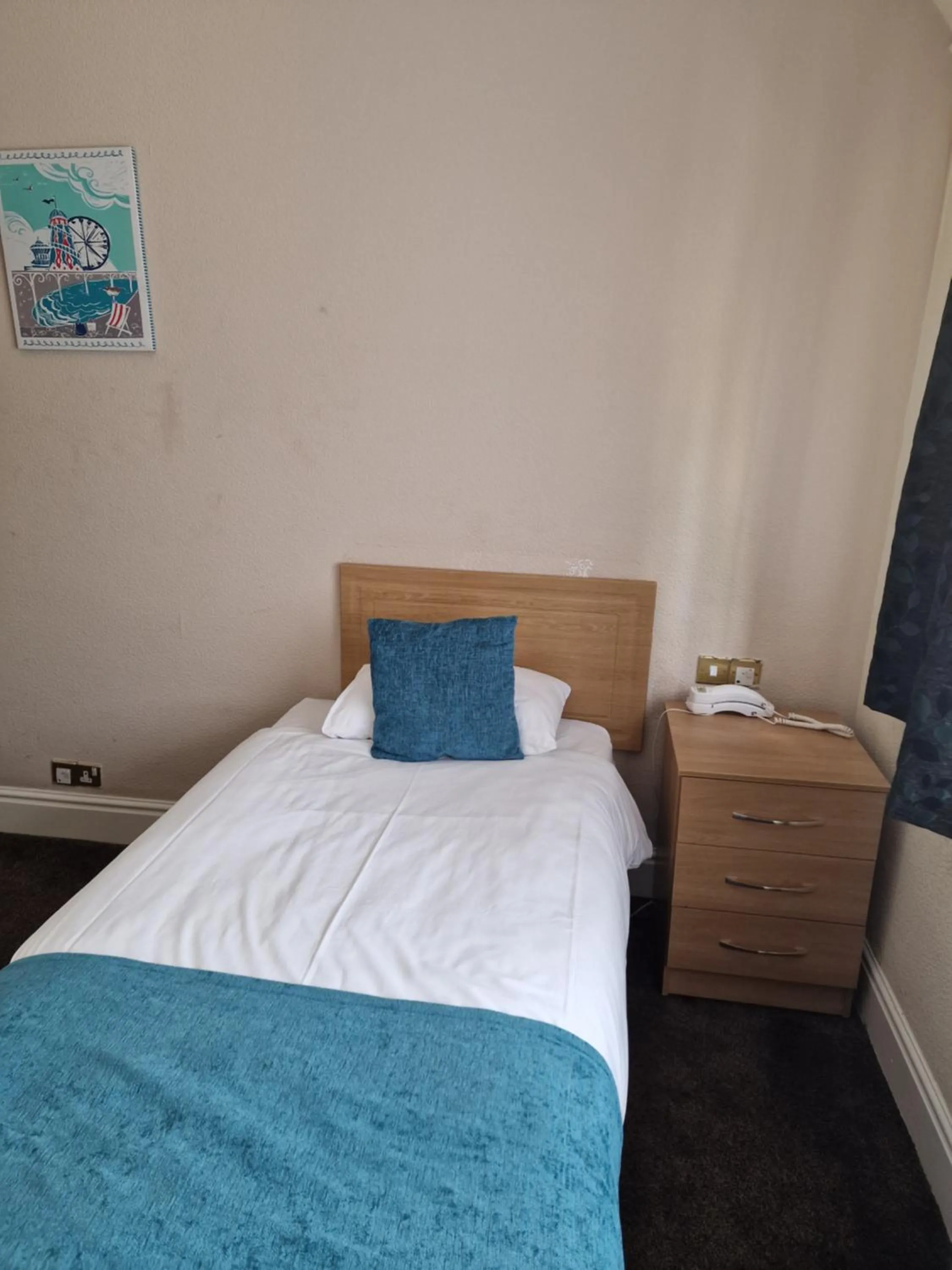 Bed in Royal Court Hotel