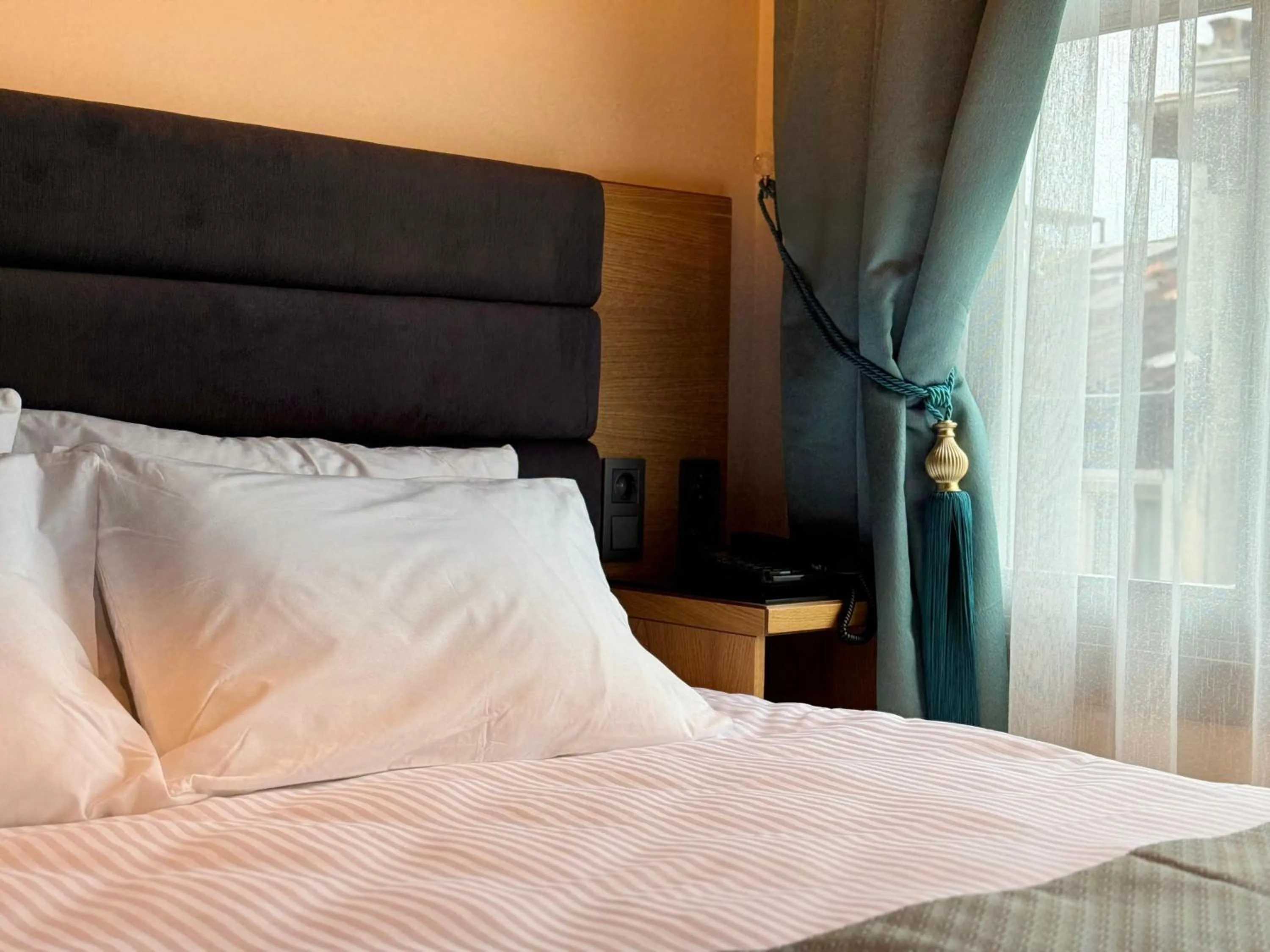 Bed in Abelia Mansion Hotel