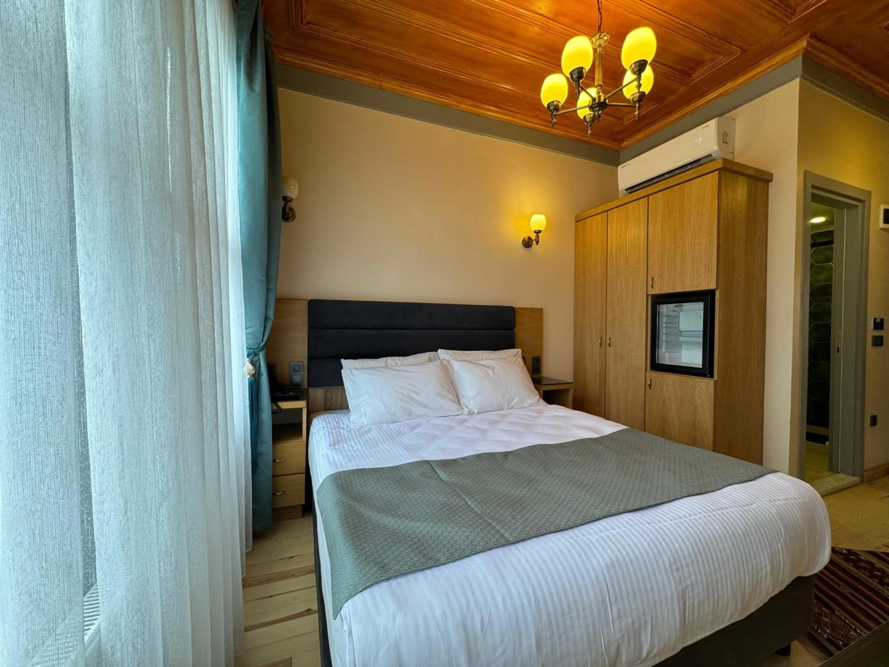 Bed in Abelia Mansion Hotel