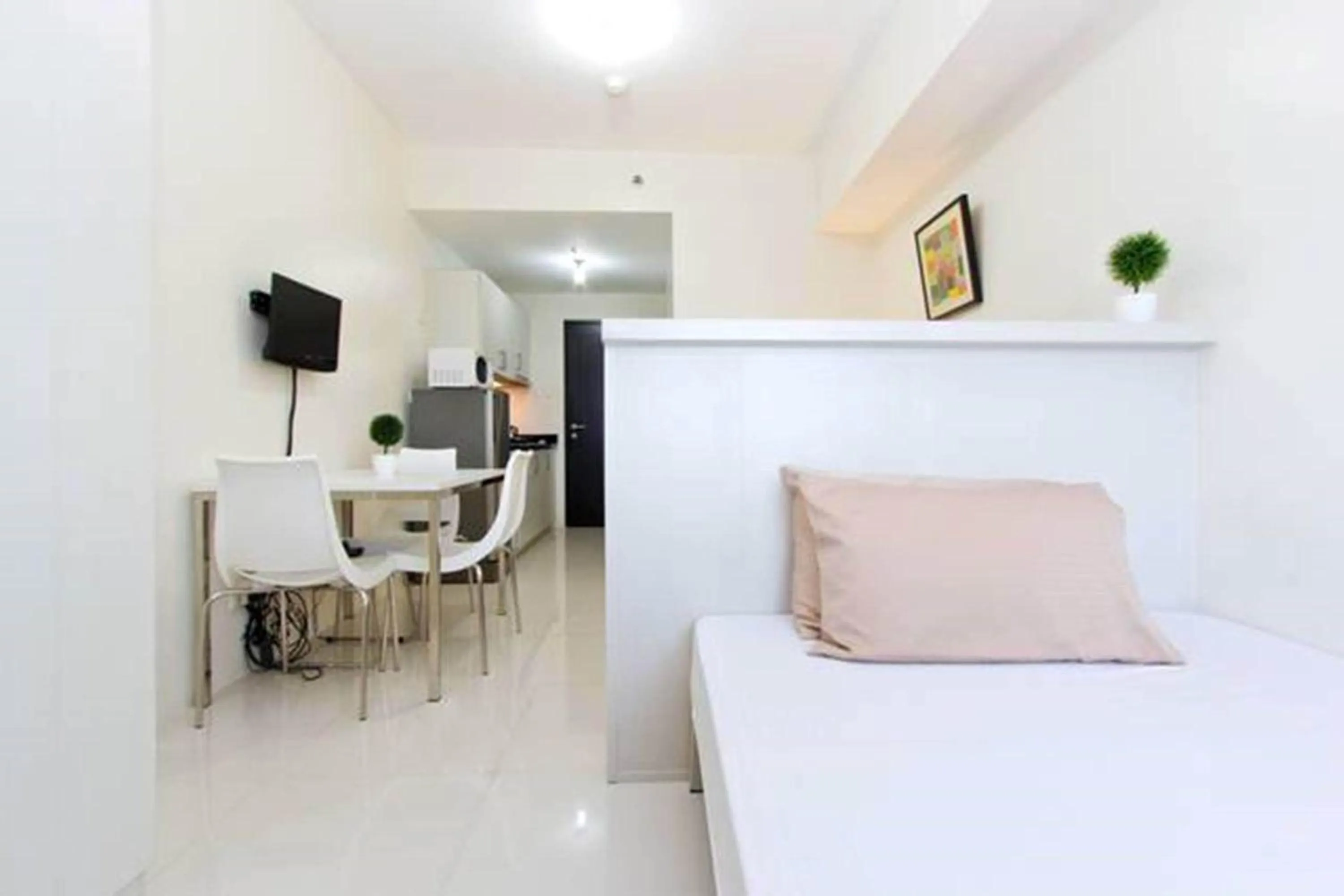 Bed in Condo Studio Luxe in Princeton Residences