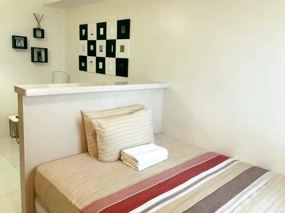 Bed in Condo Studio Luxe in Princeton Residences