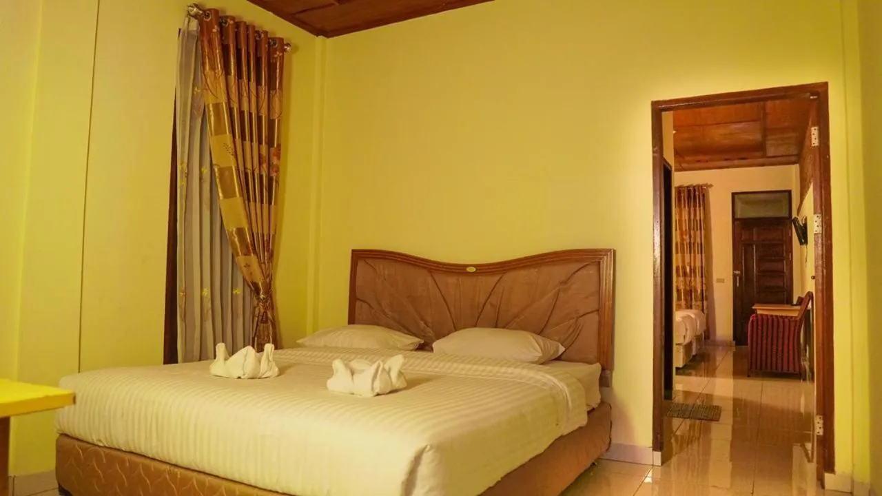 Bed in Judita Cottages