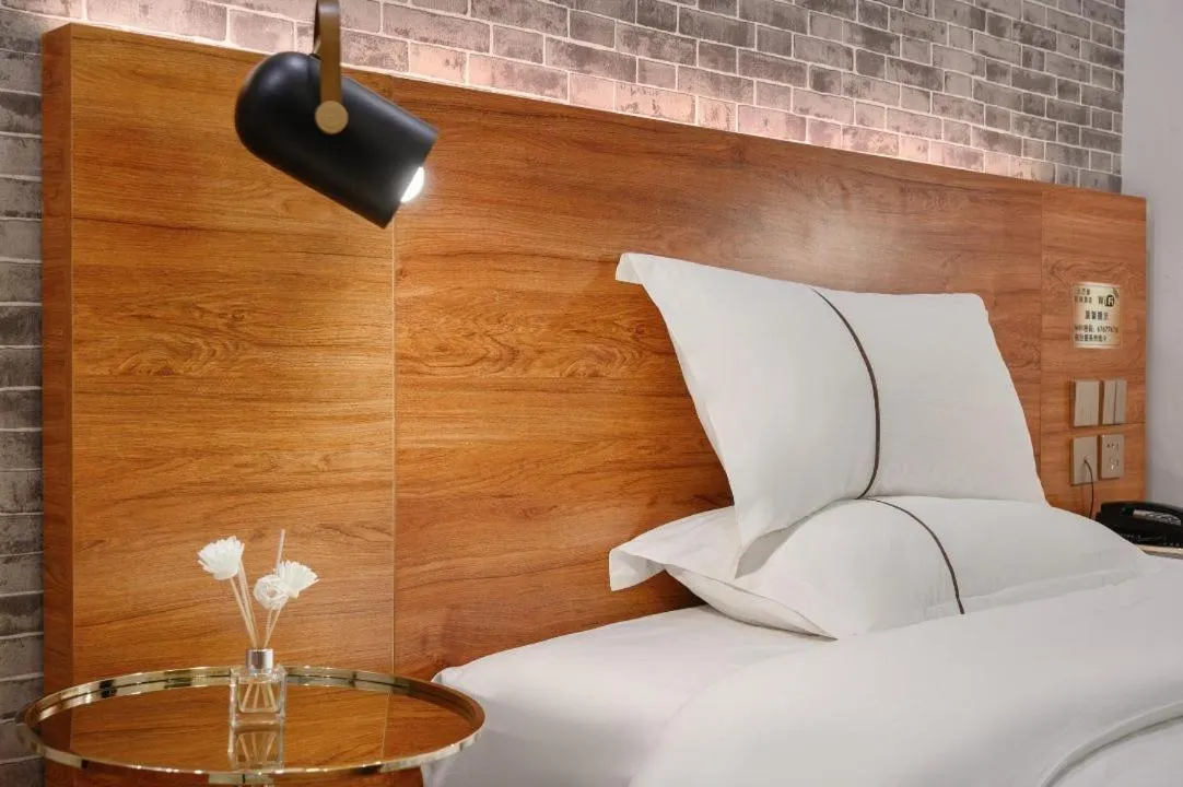 Bed in QiQiaoWu Fashion Hotel Beijing Songjiazhuang Subway Station