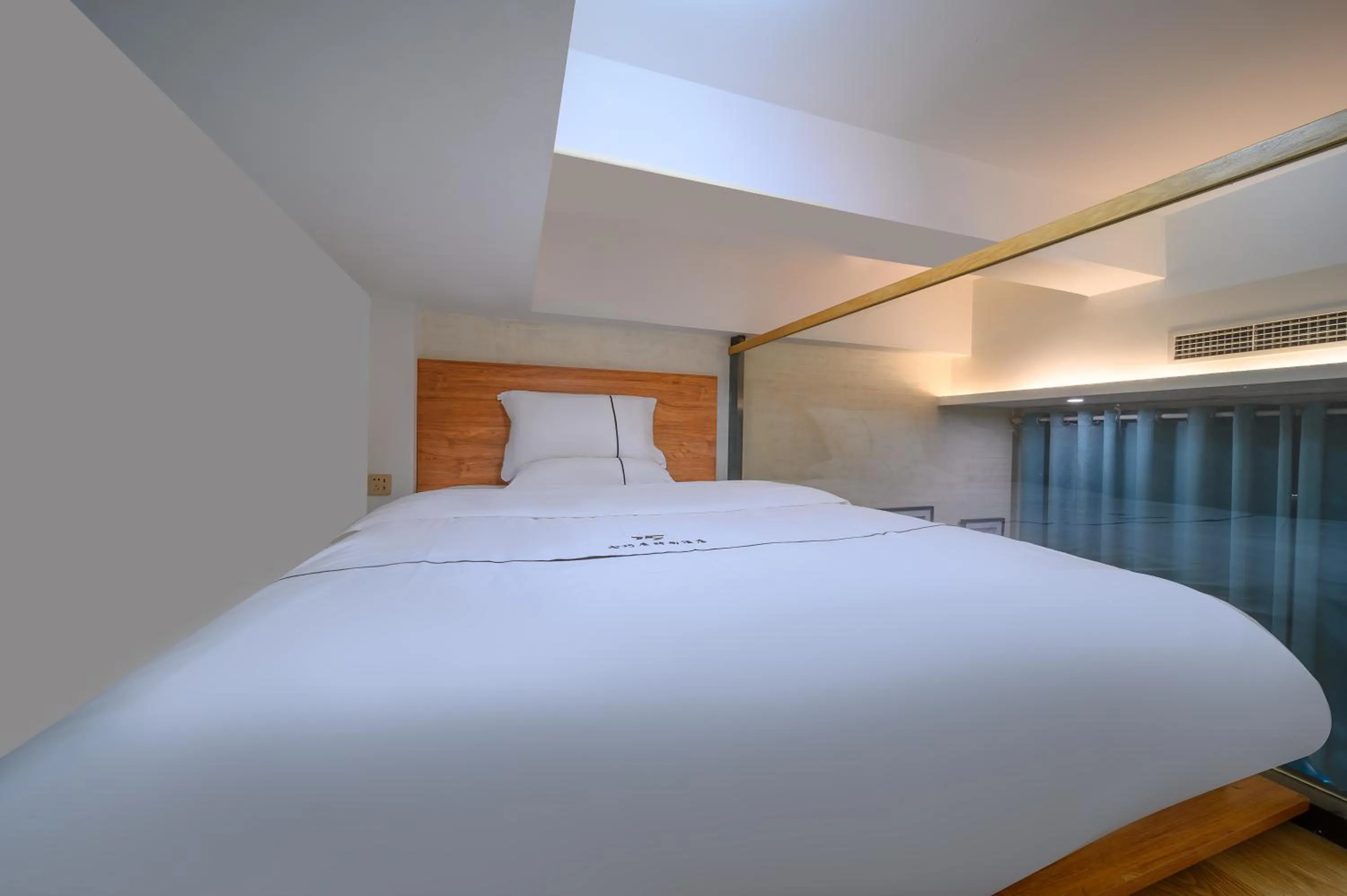 Bed in QiQiaoWu Fashion Hotel Beijing Songjiazhuang Subway Station