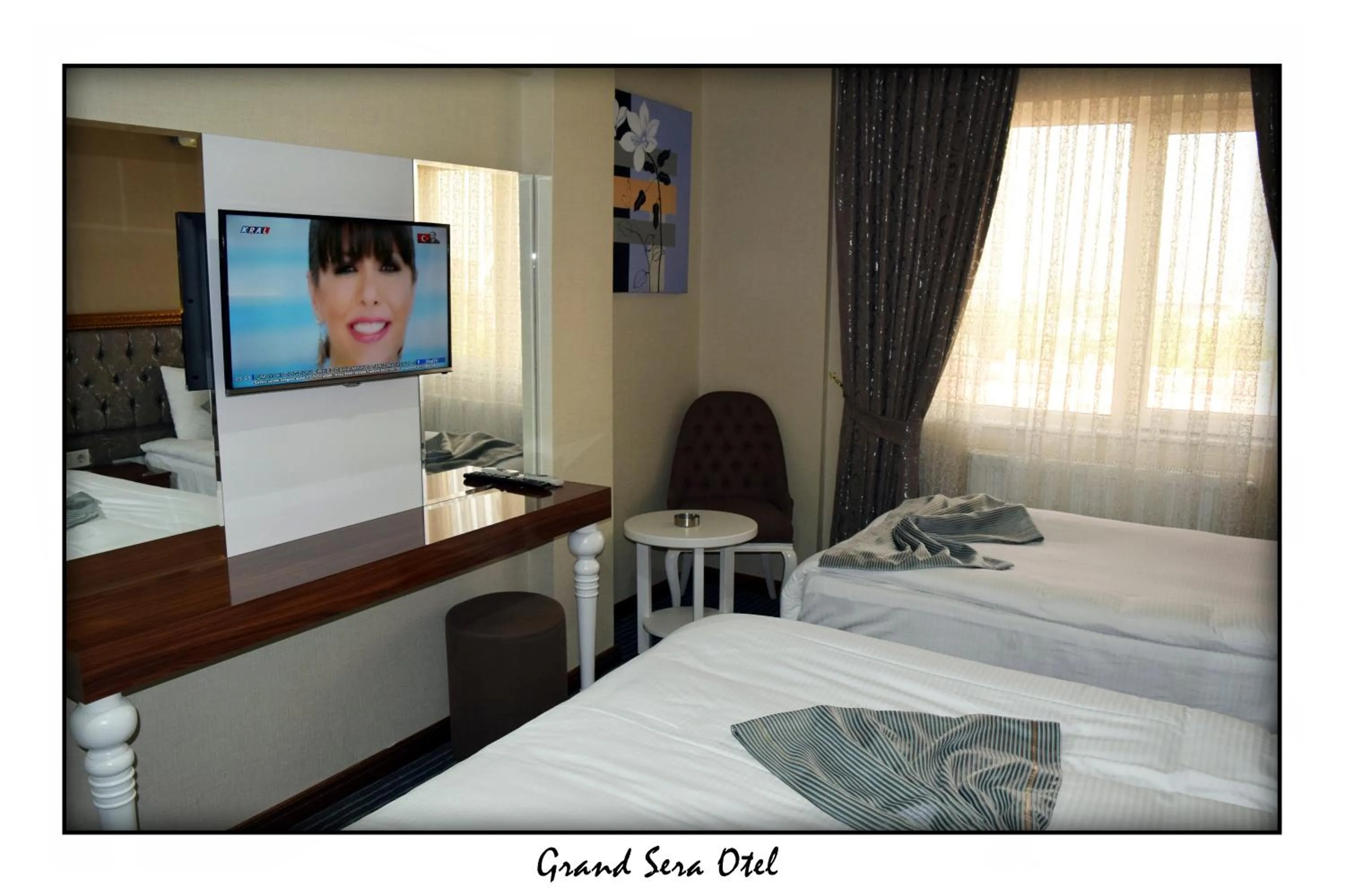 Text overlay, Bed in Grand Sera Hotel