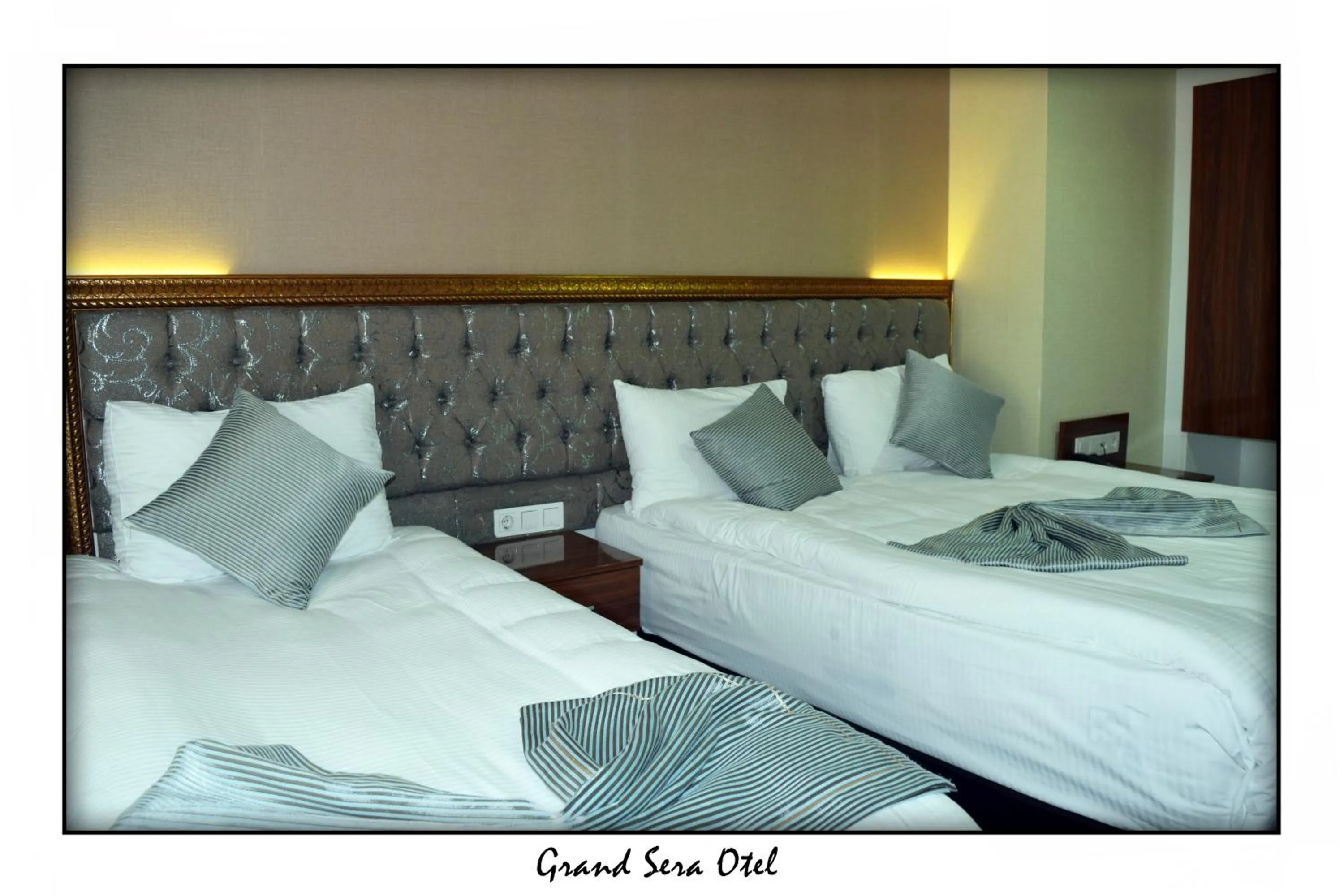 Text overlay, Bed in Grand Sera Hotel
