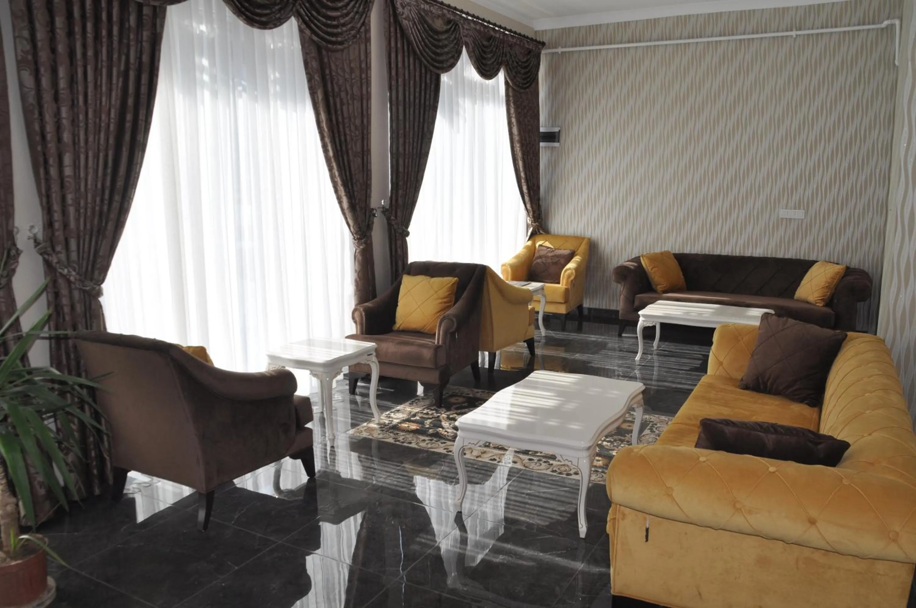 Communal lounge/ TV room in Grand Sera Hotel