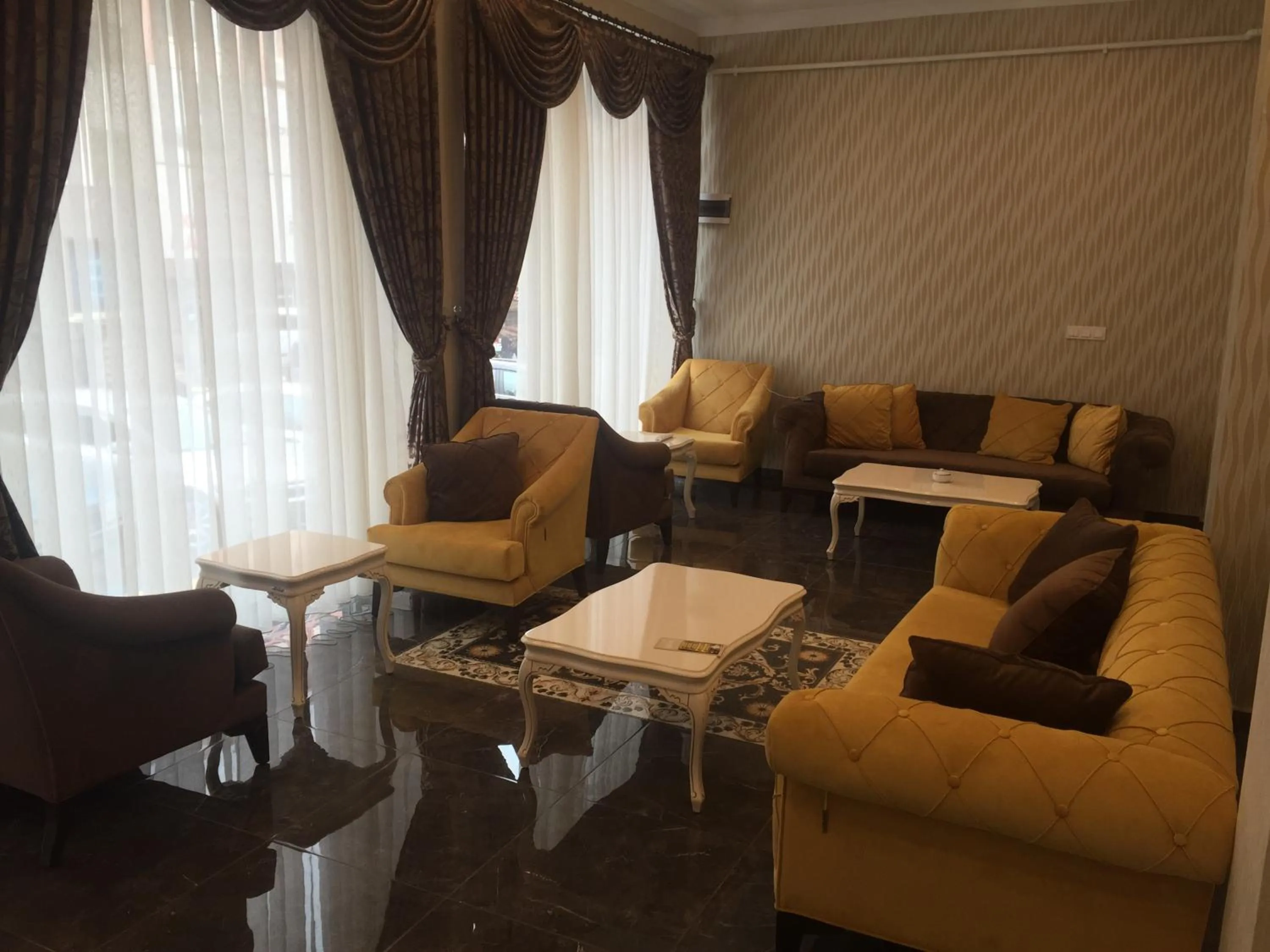 Communal lounge/ TV room in Grand Sera Hotel