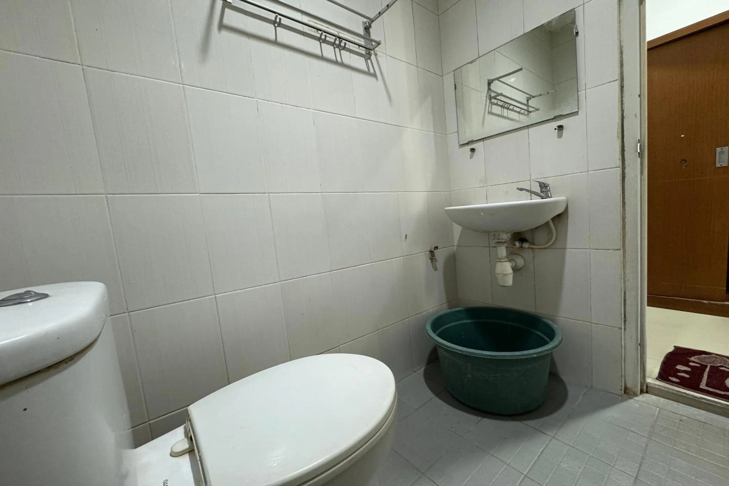 Bedroom in Hotel O Ezhar Boka Homestay Near GOR Sulis Bulutangkis