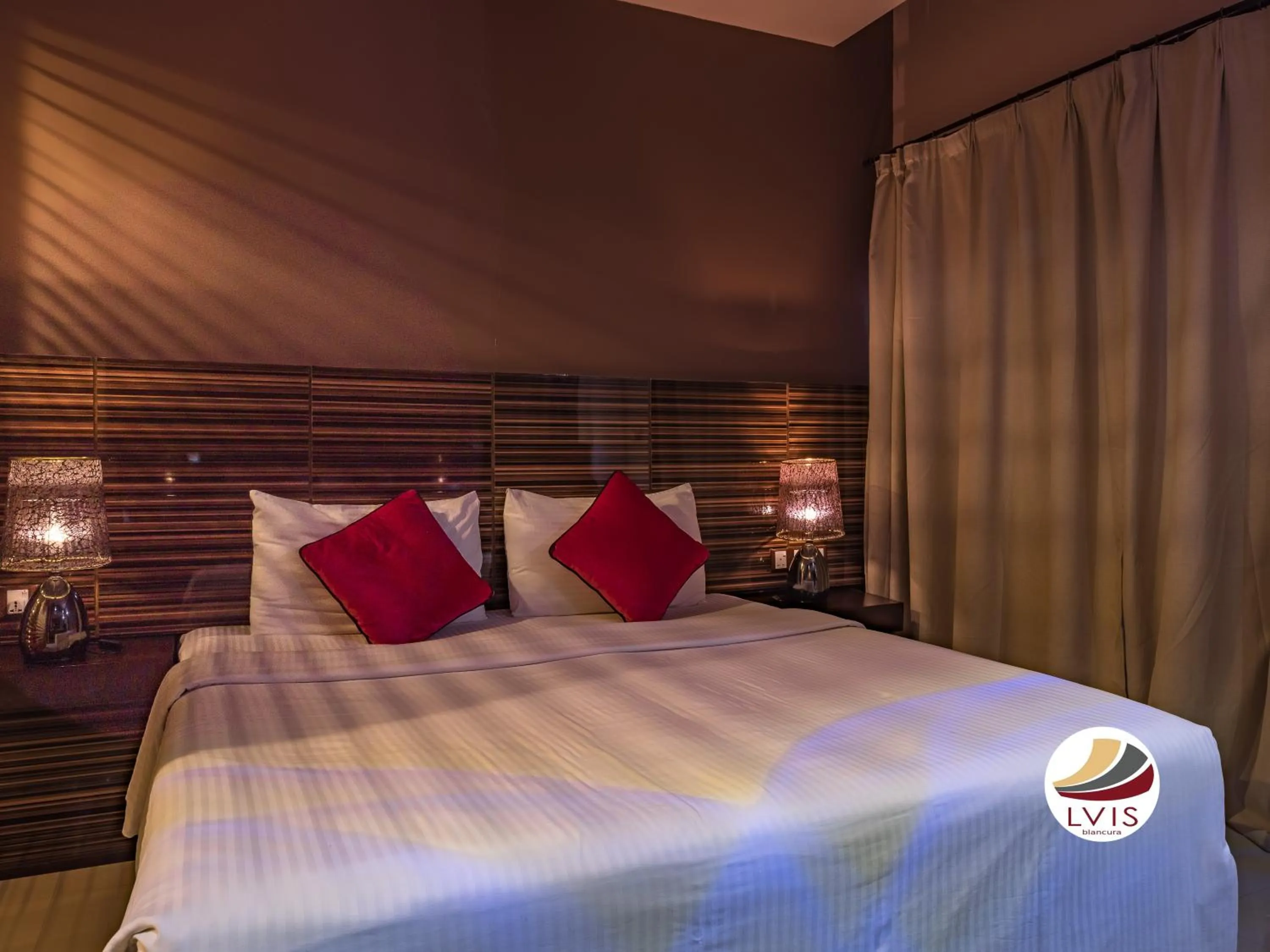 Bed in LVIS blancura Hotel