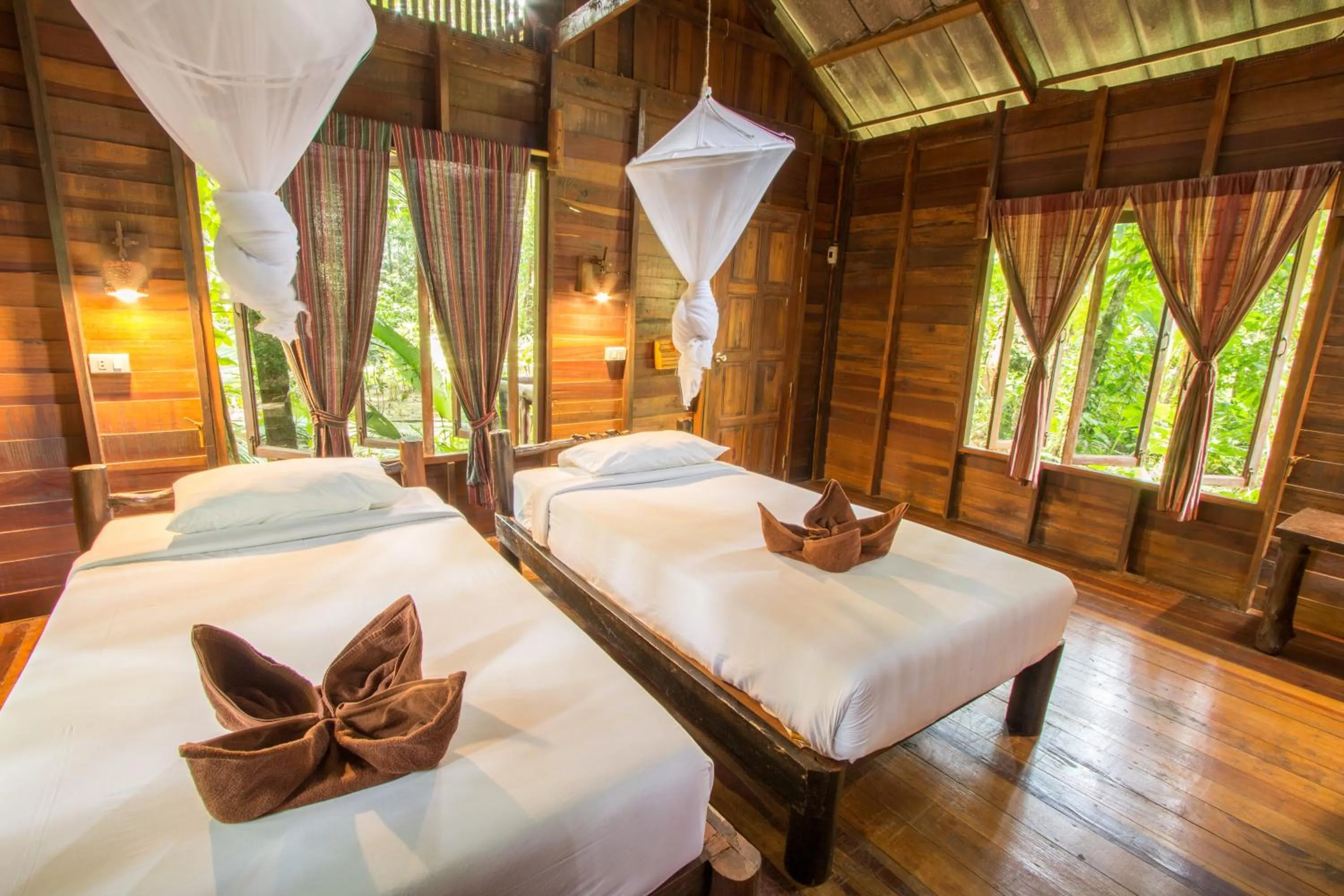 Bed in Khao Sok Riverside Cottages