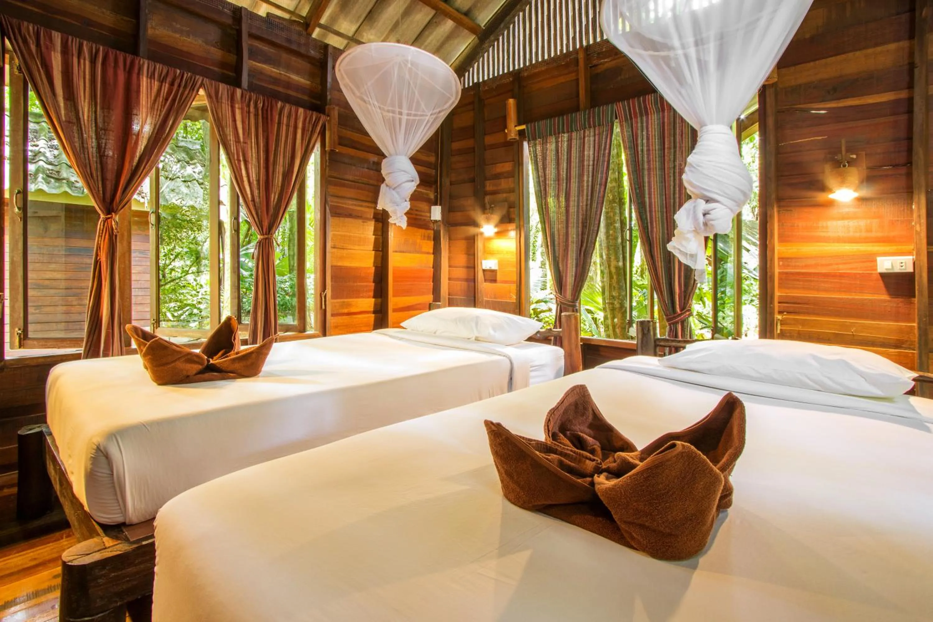 Bed in Khao Sok Riverside Cottages